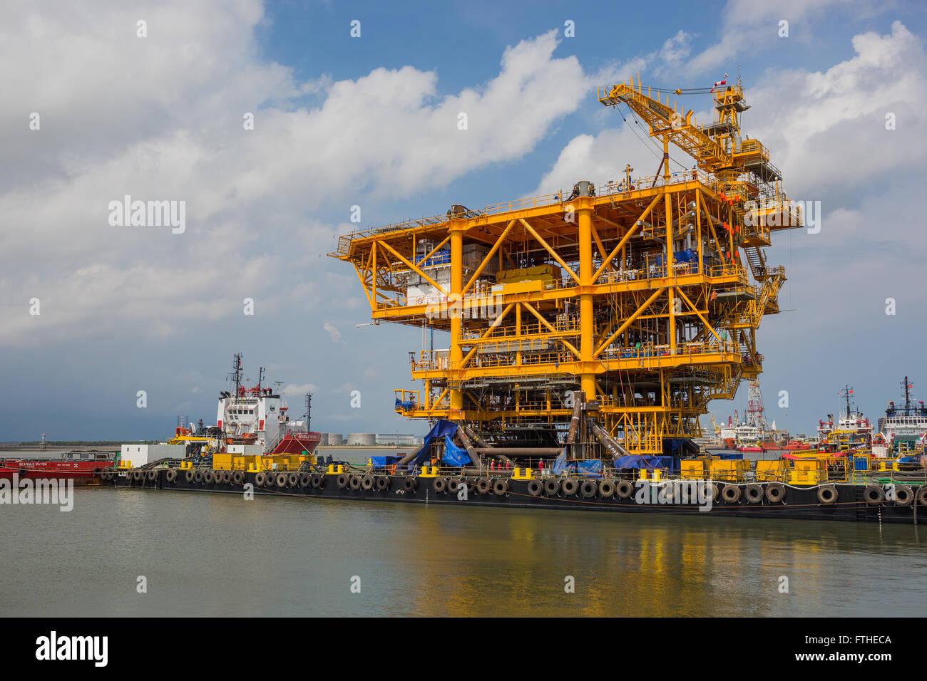 Oil rig topside on a barge before sailing away Stock Photo - Alamy