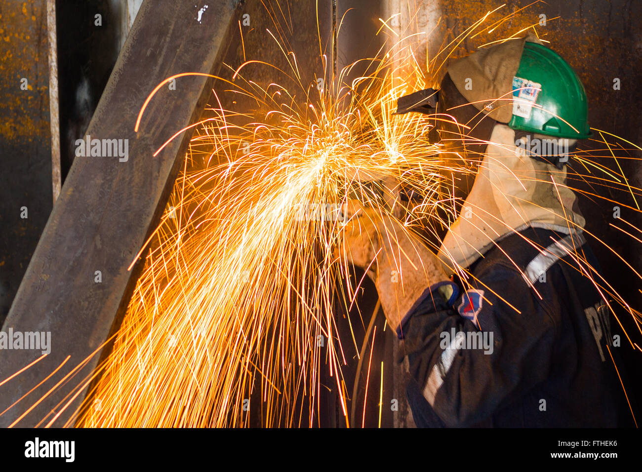 Man welding on oil rig Stock Photo