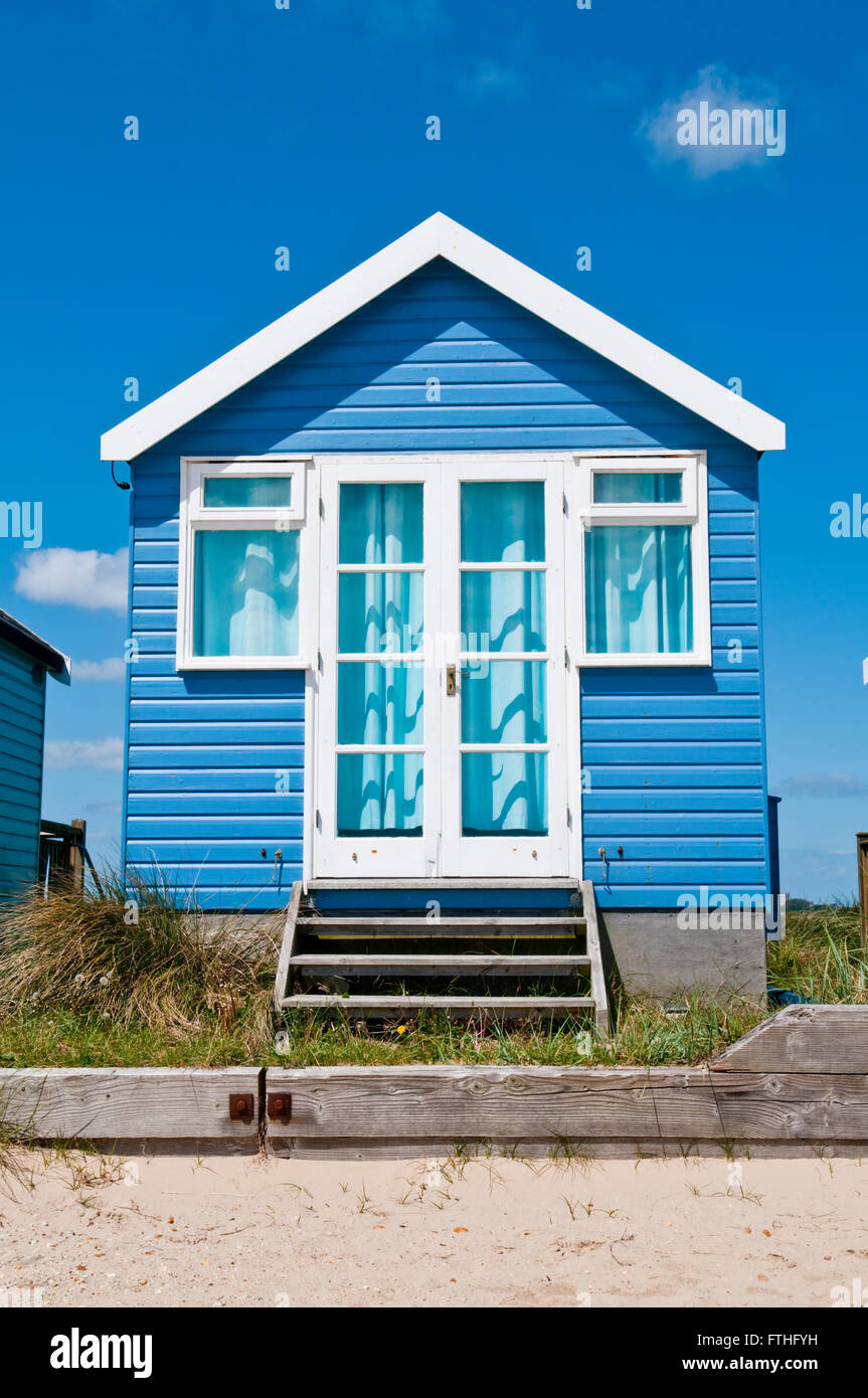 A blue and white beach hut at Mudeford Sandbank, Hengistbury Head, near Christchurch, Dorset Stock Photo
