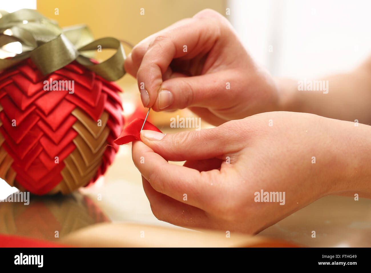 Christmas ornament with ribbon. Christmas decoration, christmas ornament made by laced. Stock Photo