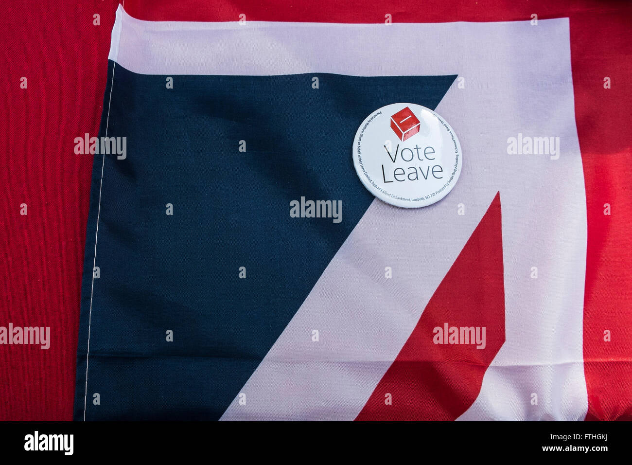 A badge supporting the UK exit from the European Union rests on a folded Union Flag. Stock Photo