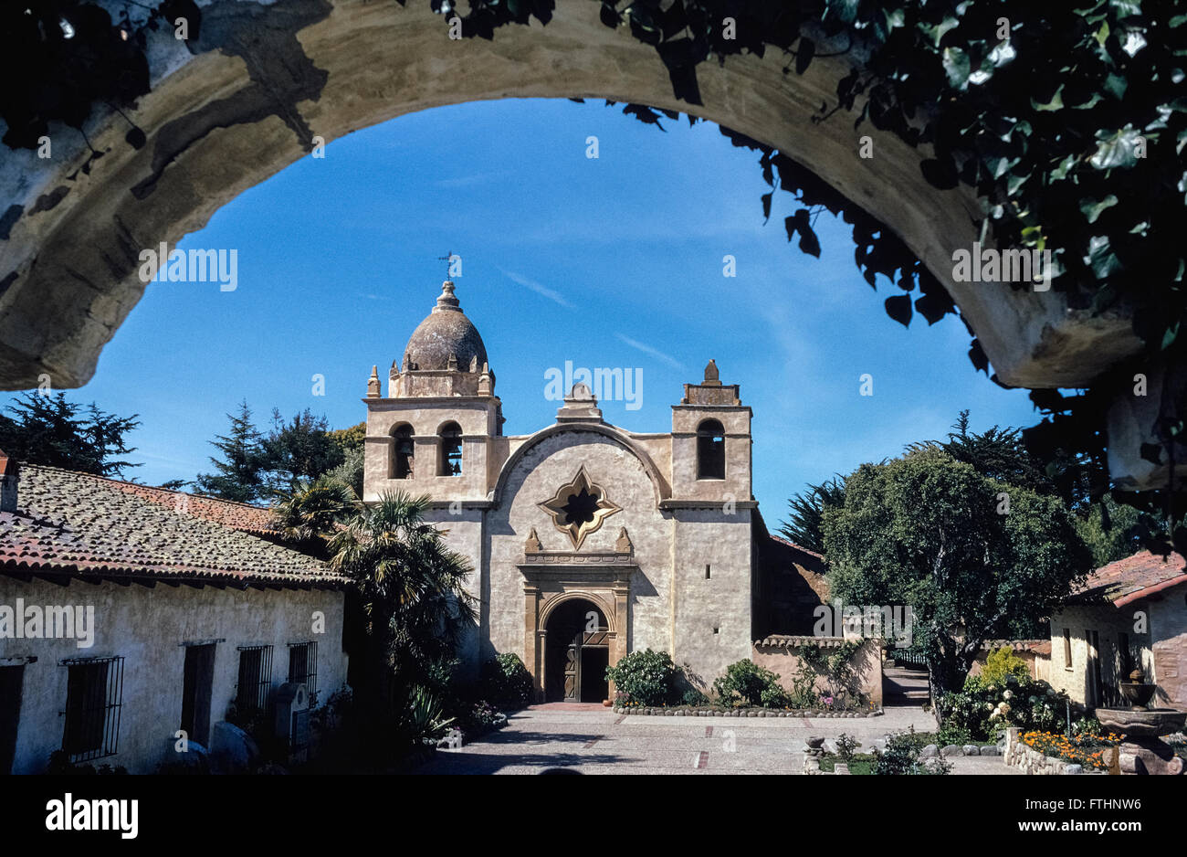 The Basilica Church of Mission San Carlos Borromeo de Carmelo was founded in 1771 by Father Junipero Serra  in what is now Carmel, California, USA. The fabled Spanish priest who was a Franciscan friar became a Catholic saint when canonized by Pope Francis in September, 2015. The Carmel mission was the second of 21 California missions established up and down the state; it was one of nine founded by Saint Serra. He died there in1784 at the age of 70 and is buried under the sanctuary floor. Stock Photo