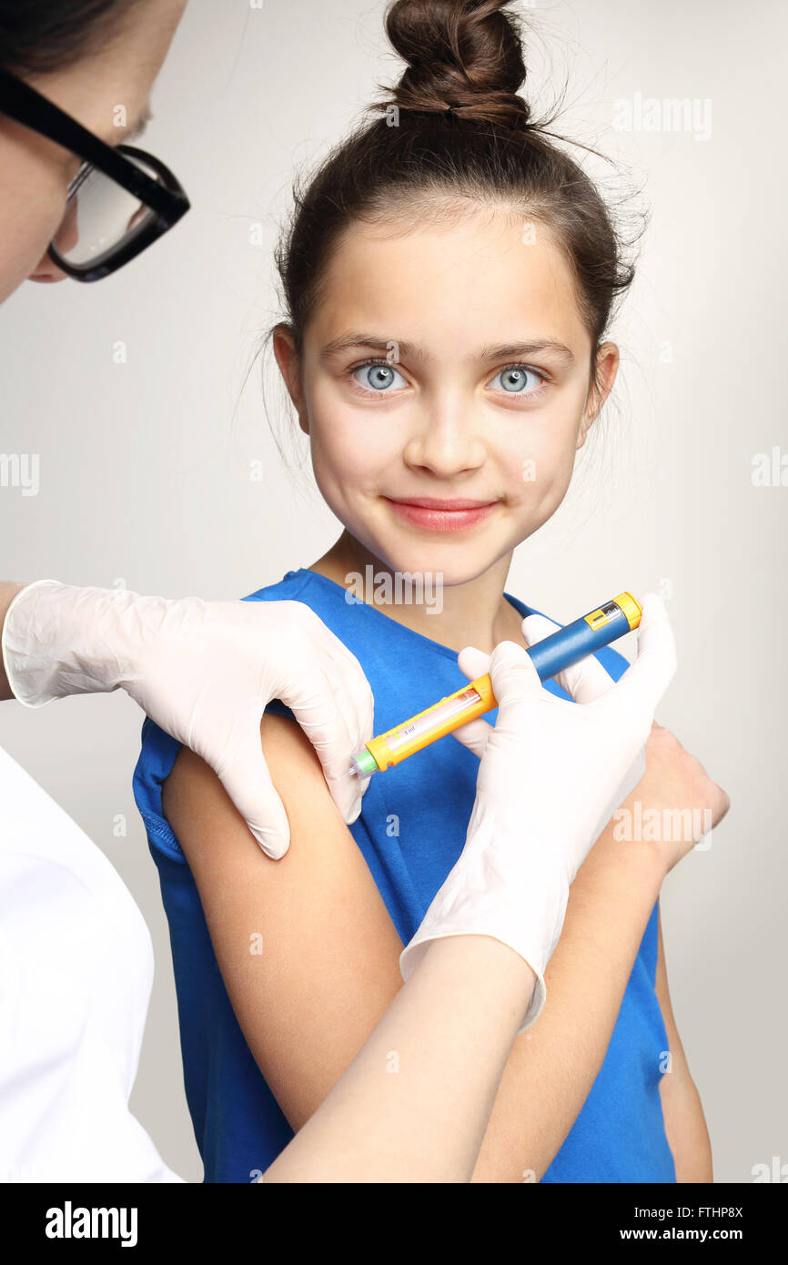 Diabetes, child take insulin. Girl with diabetes during the injections