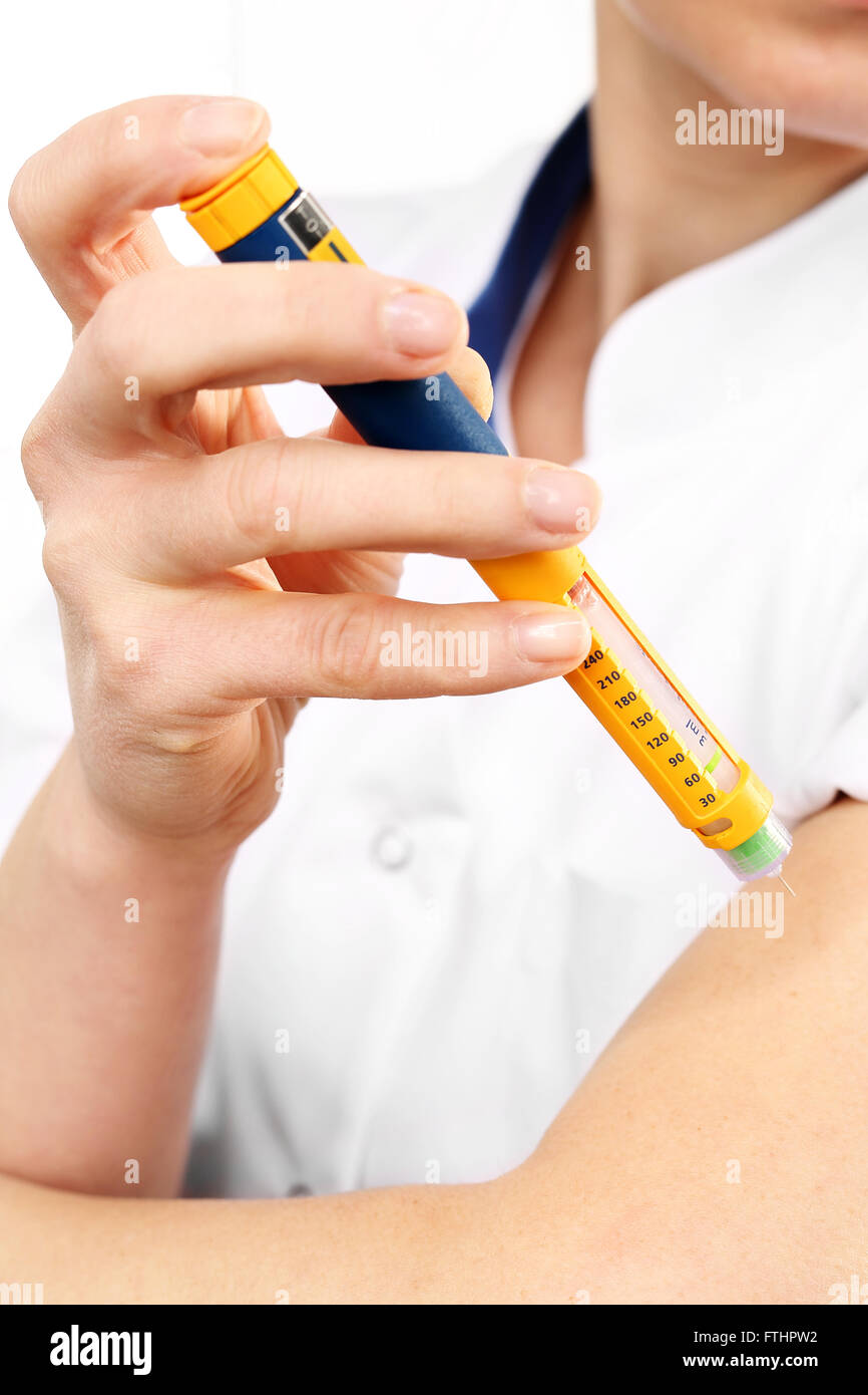 A woman injected insulin in the arm Stock Photo Alamy