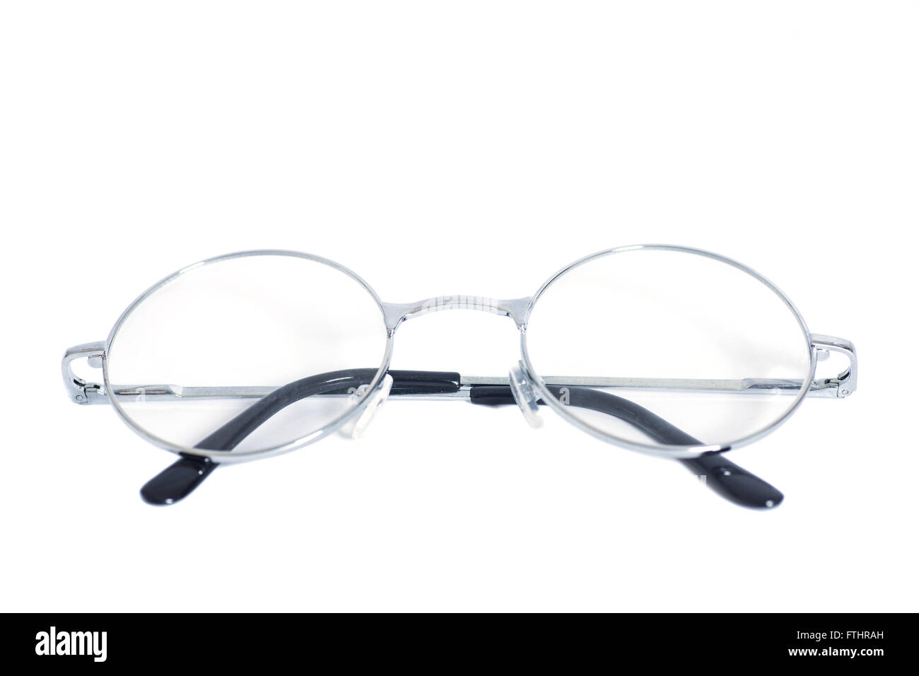 Folded round eyeglasses isolated on white background Stock Photo - Alamy