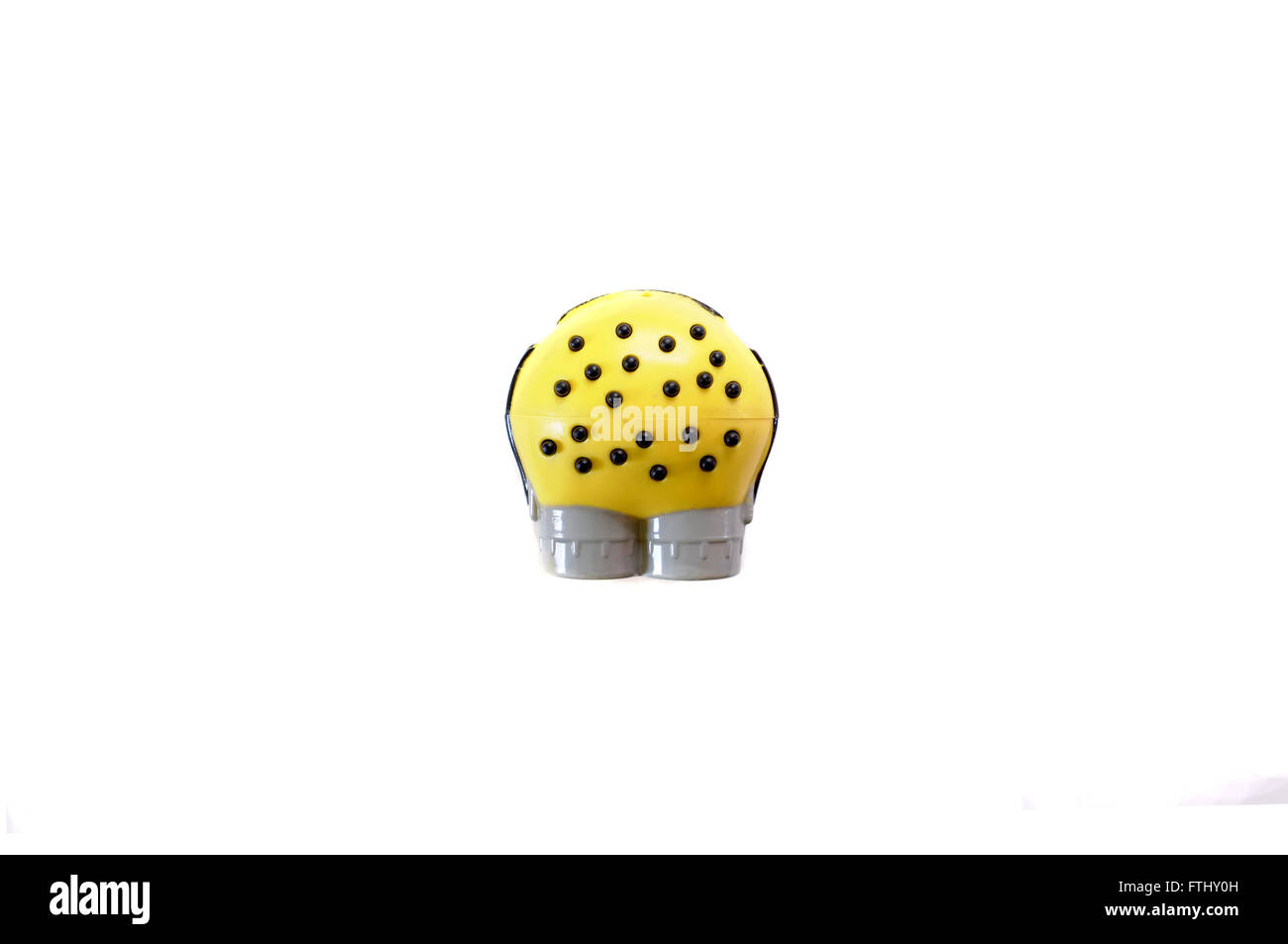 An overhead view of a toy figure from the Minions film photographed against a white background. Stock Photo