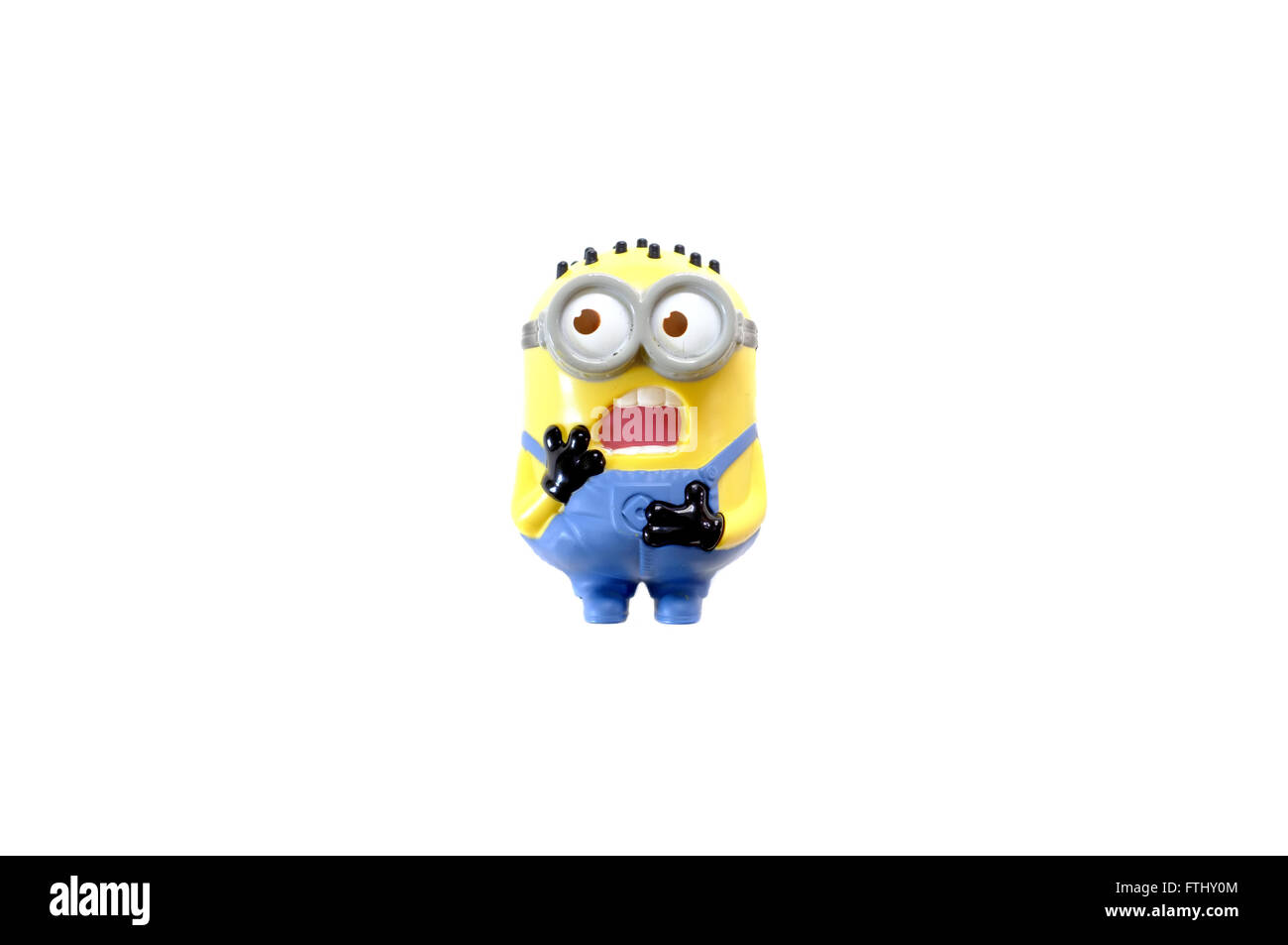 A toy figure from the Minions film photographed against a white background. Stock Photo