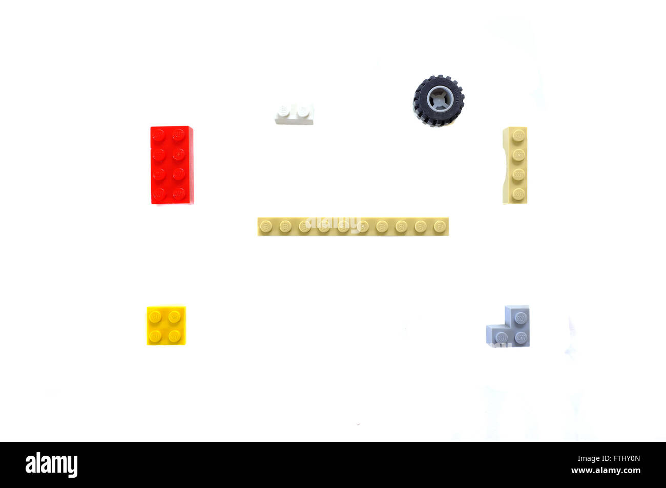 A selection of Lego pieces photographed against a white background. Stock Photo