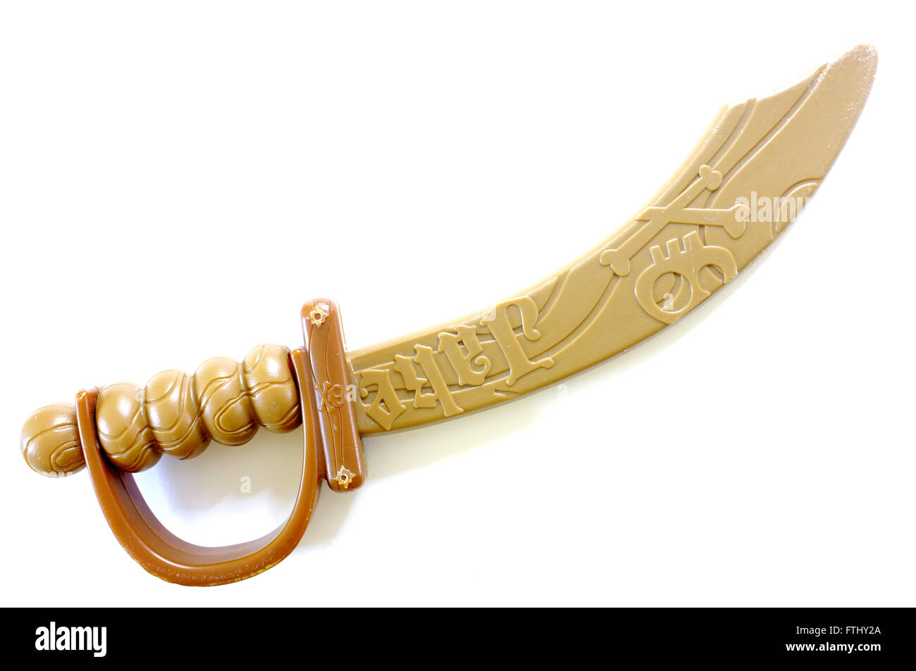 A plastic toy sword photographed against a white background Stock Photo