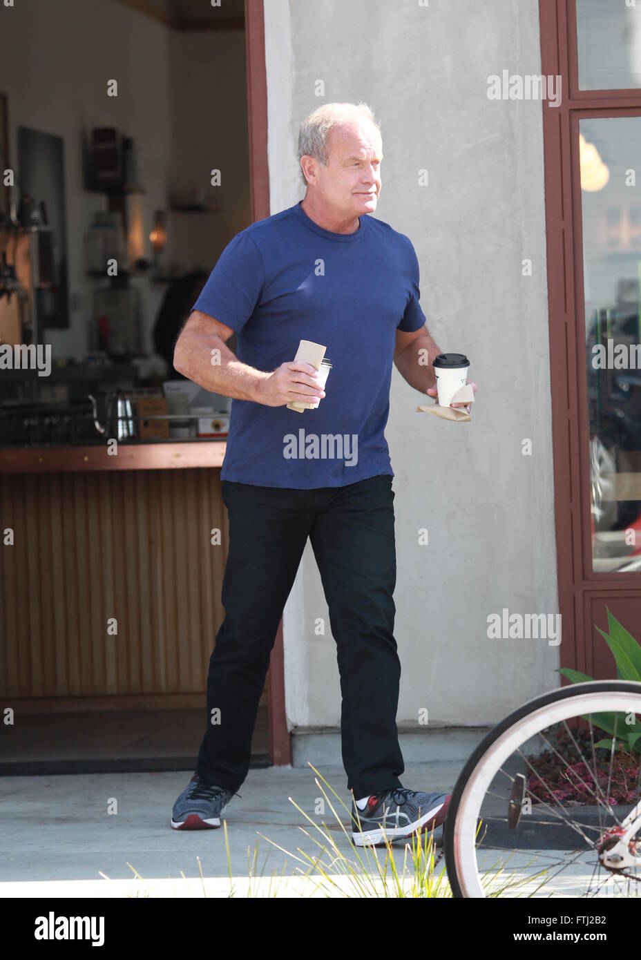 Kelsey Grammar shows off his muscles doing standing push ups on the