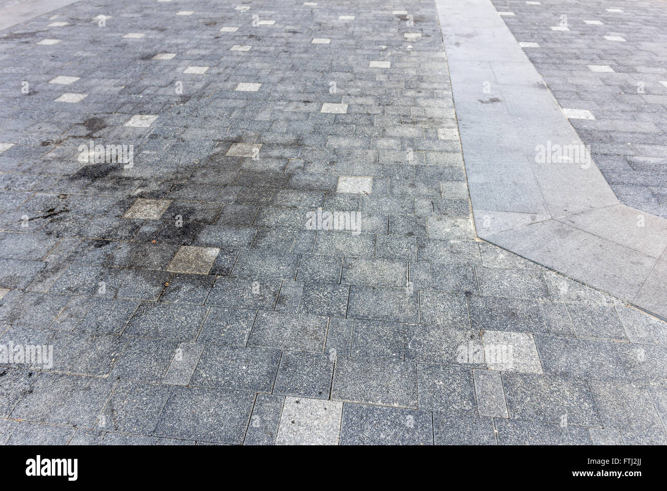 Perspective View of Monotone Gray dirty Brick Stone Street Road. Sidewalk, Pavement Texture Background Stock Photo
