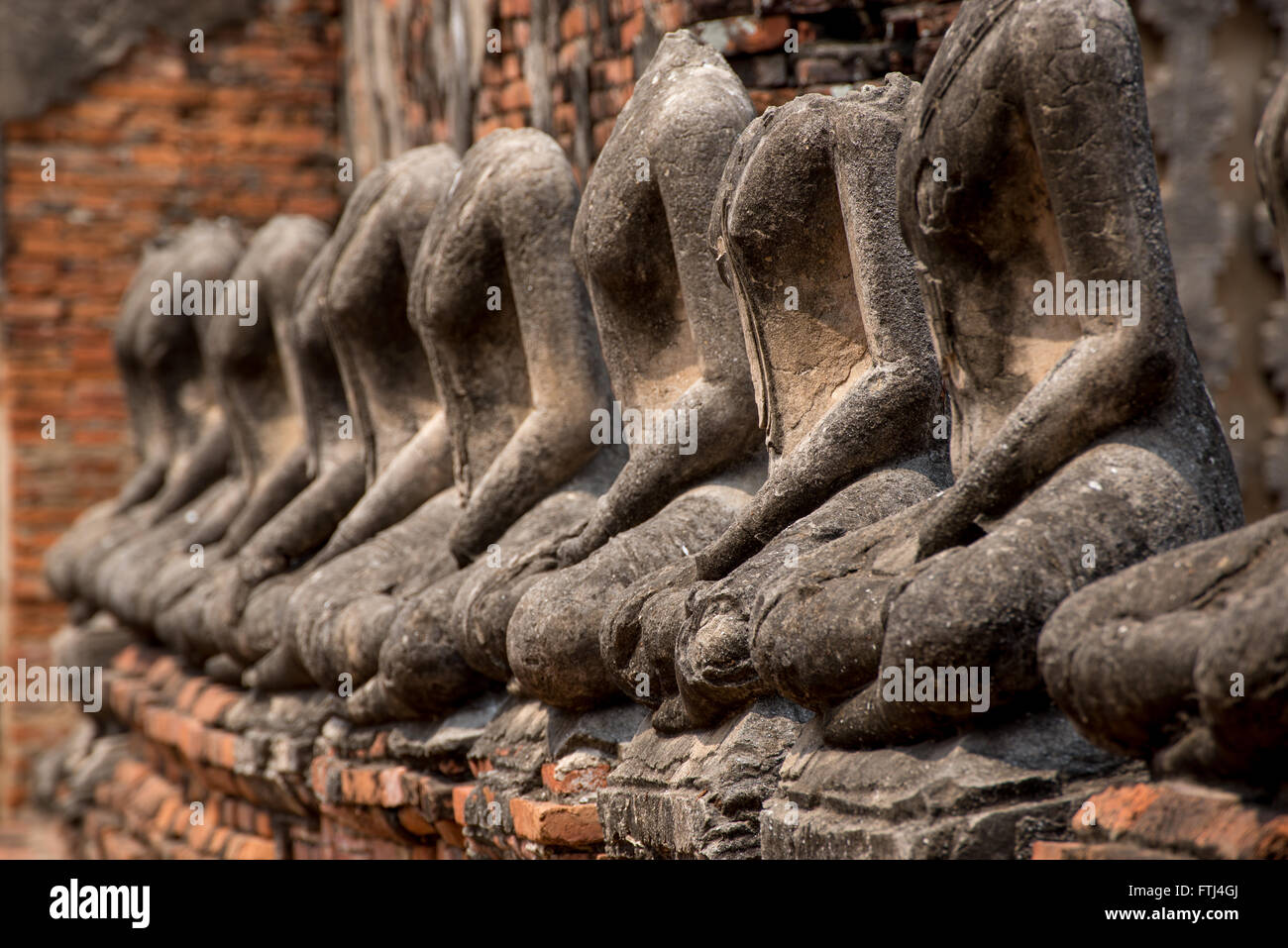 Headless statues of Buddha in the ruins of an ancient temple, Ayutthaya, Thailand Stock Photo
