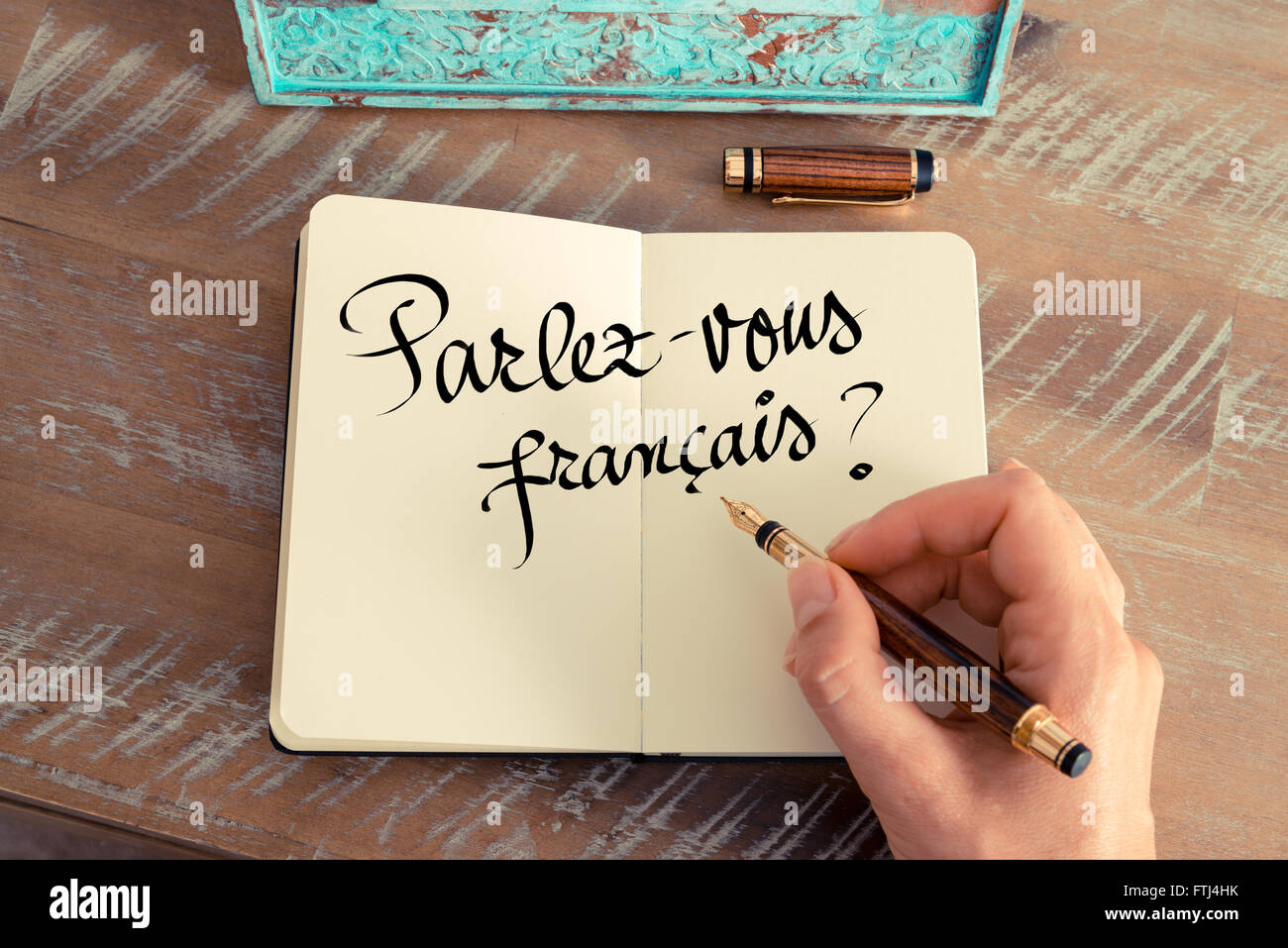 Handwritten text Parlez Vous Francais?" in french translation Do you speak French ? as