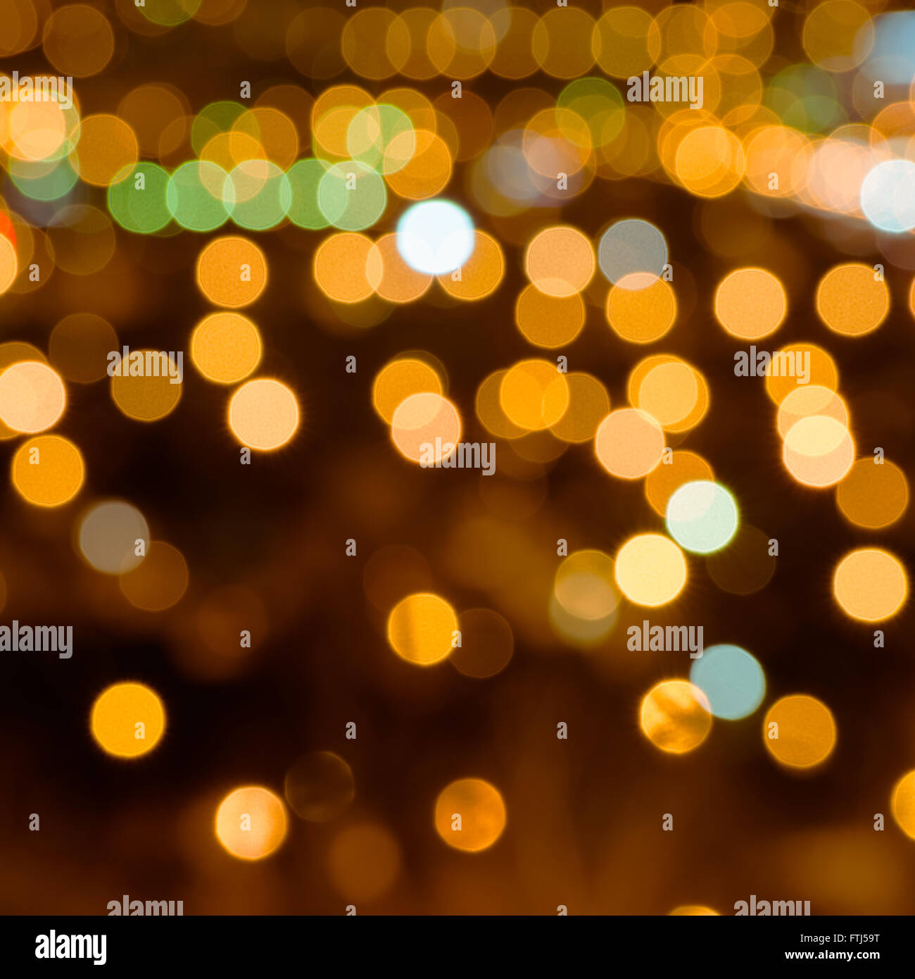abstract festive background with bright golden lights, close up Stock Photo