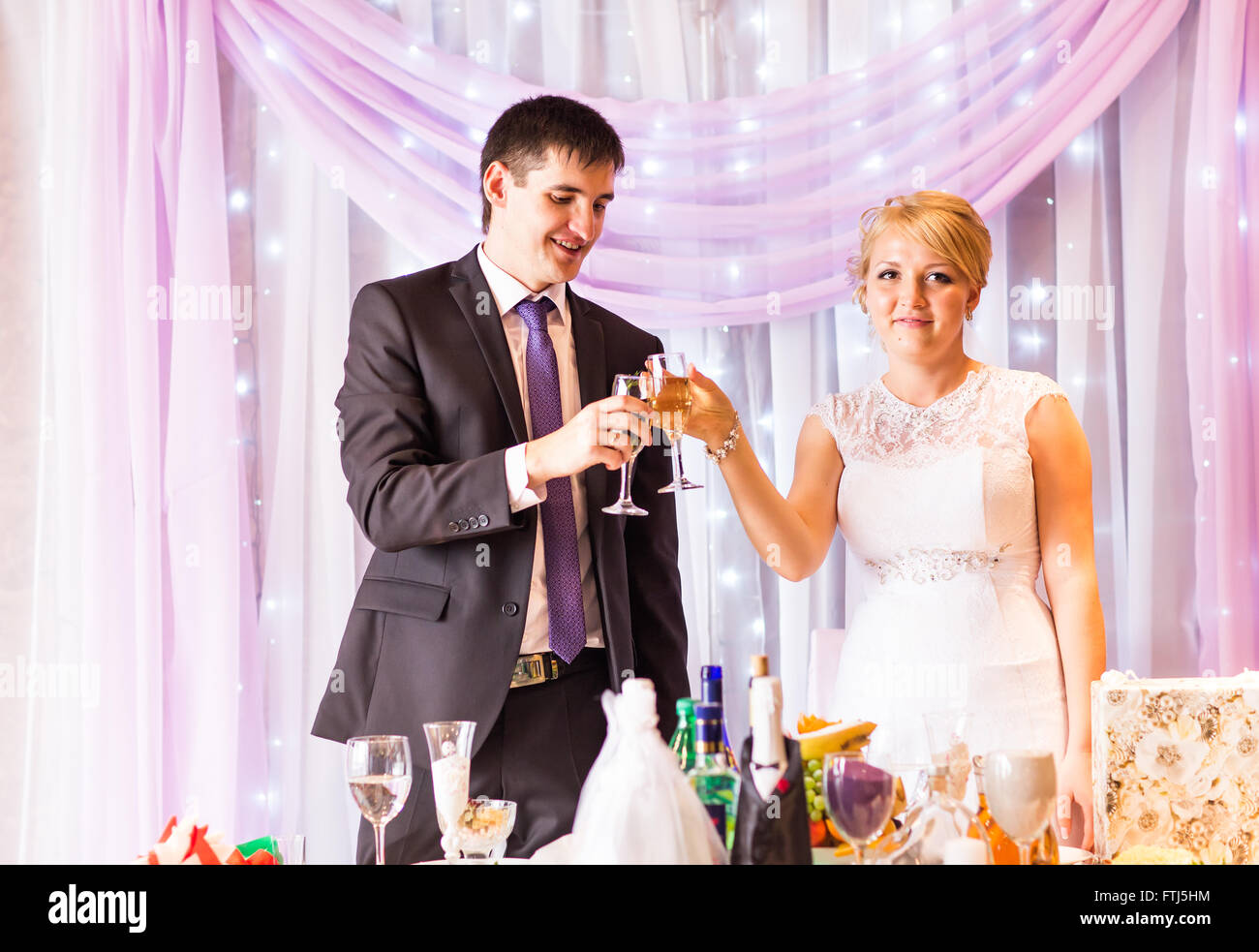 Bride And Groom Celebrating At Reception Stock Photo - Alamy