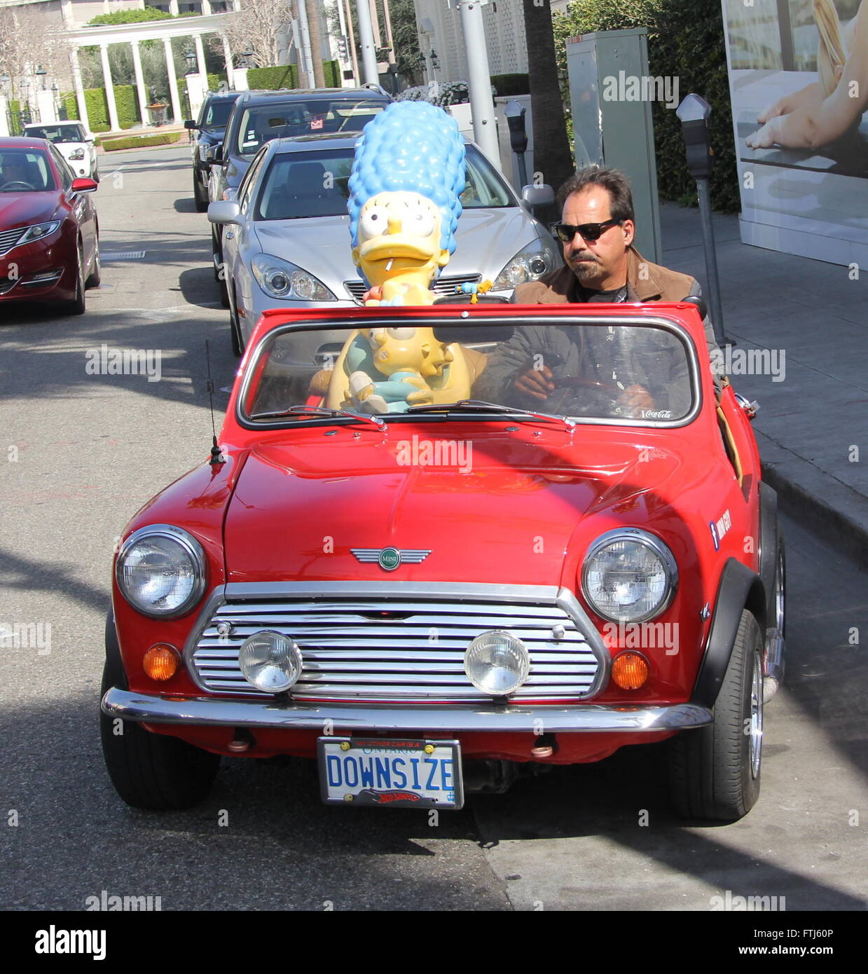 Character Dummies Of Marge Simpson And Baby Maggie From The Animated U S Tv Show The Simpsons Being Driven Around In A Red Convertible Miniguy In Los Angeles California Featuring Marge Simpson Baby