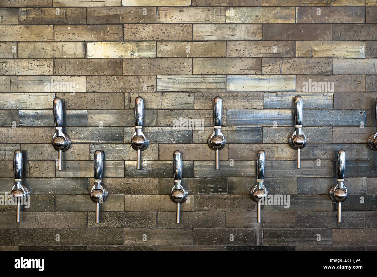 Taphouse in Portland Oregon with multiple tap handles for craft beer and wine. Stock Photo