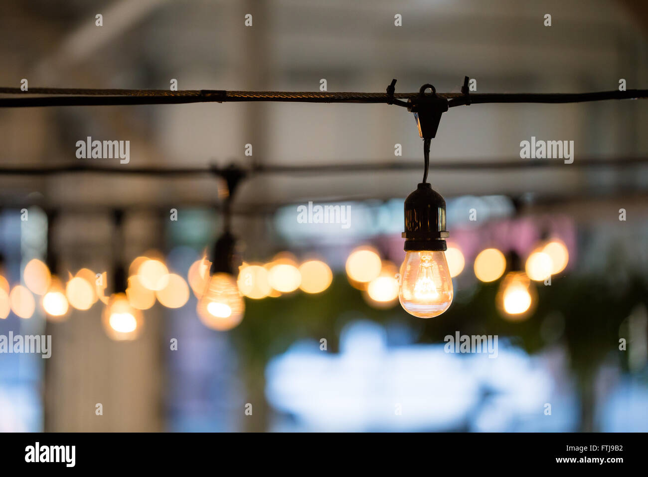 String lights lighting a wedding reception in the Winter in Oregon. Stock Photo