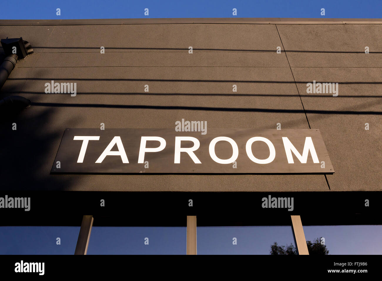 Taproom sign at a popular taphouse serving craft beer and growler fills. Stock Photo