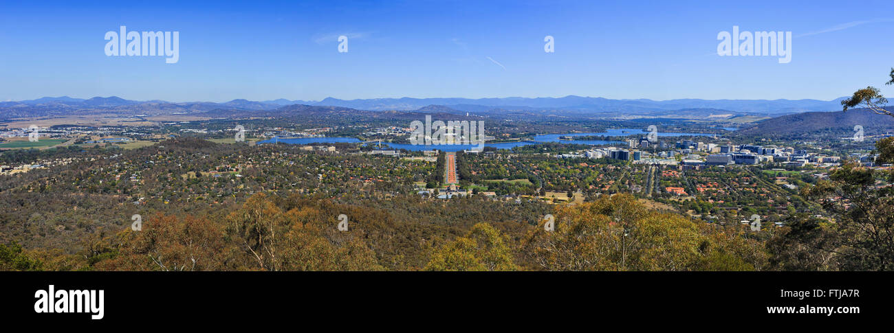 Aerial panorama of Canberra city on a sunny bright day as seen from Mount Ainslie with parliament buildings, Anzac parade Stock Photo