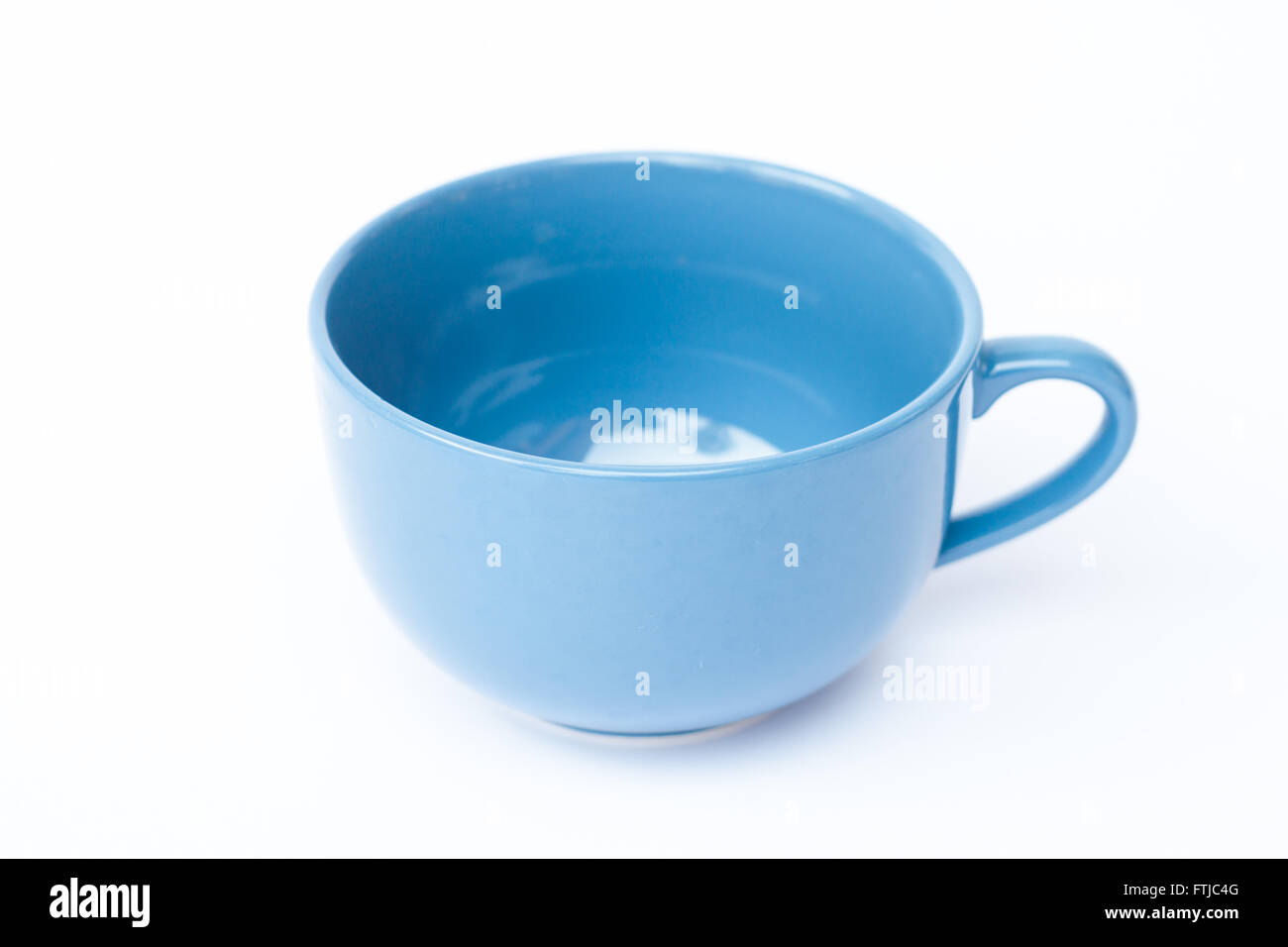 Blue ceramic bowl on white background, stock photo Stock Photo