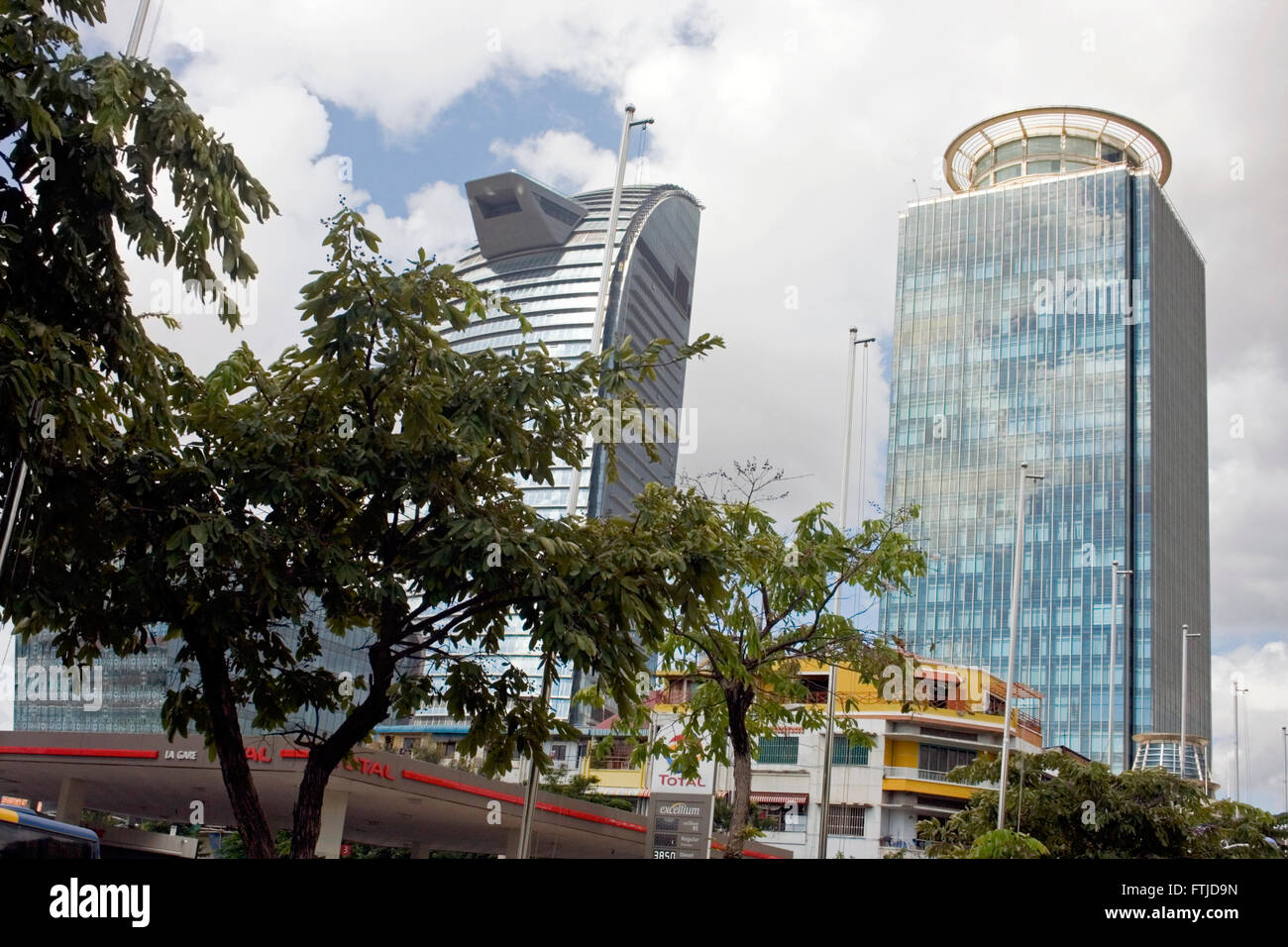 The new Vattanac Capital Tower (left) and Canadia Tower rise above a city street in Phnom Penh, Cambodia. Stock Photo