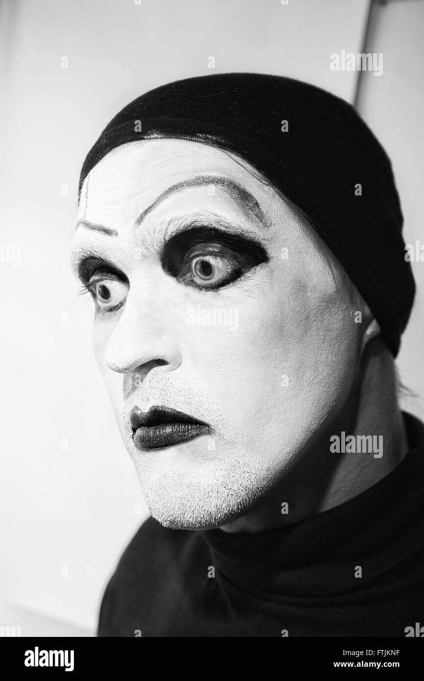 Theatrical actor with dark makeup on her face close up Stock Photo