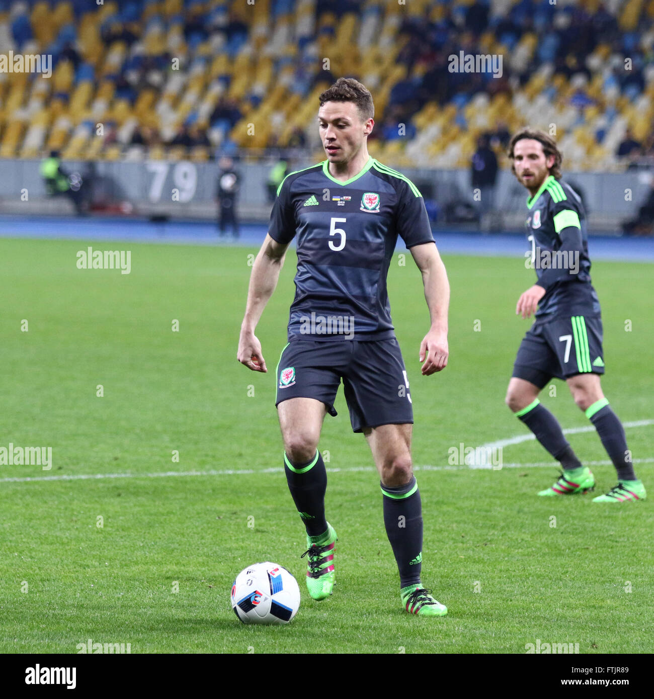 Kyiv, Ukraine. 28th March, 2016. James Chester of Wales (#8) controls a ball during the Friendly match against Ukraine at NSC Olympic stadium in Kyiv, Ukraine. Ukraine won 1-0. Credit:  Oleksandr Prykhodko/Alamy Live News Stock Photo