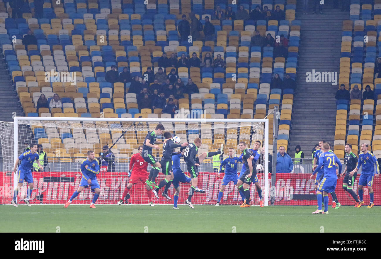Kyiv, Ukraine. 28th March, 2016. Ukrainian (in Blue) and Welsh (in Black) footballers fight for a ball during their Friendly match at NSC Olympic stadium in Kyiv, Ukraine. Ukraine won 1-0. Credit:  Oleksandr Prykhodko/Alamy Live News Stock Photo