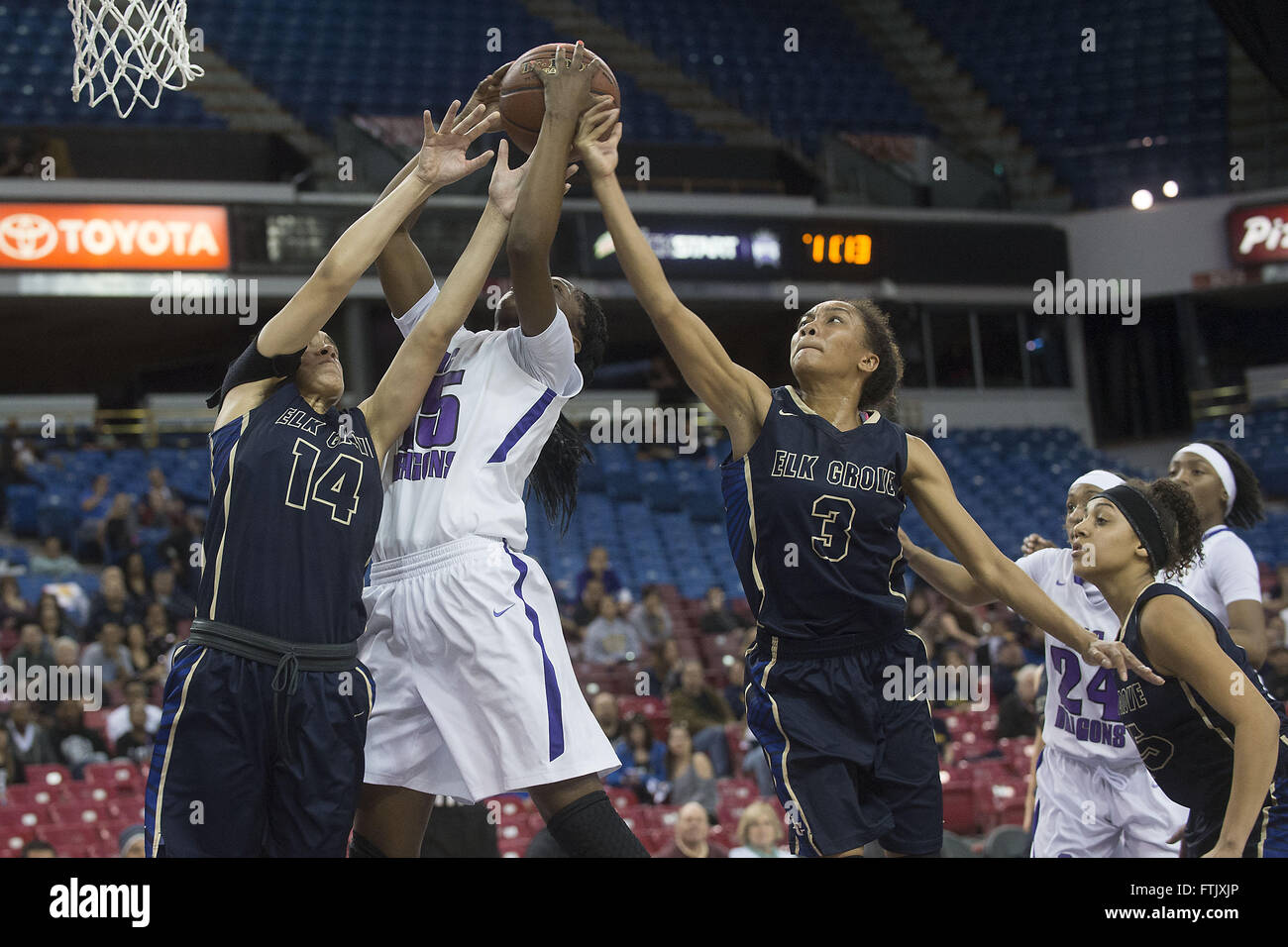 Sacramento, California, USA. 19th Mar, 2016. Thundering Herd Paiton Demps (14), Dragons Anna Blount (15) and Thundering Herd Arianna Daniel (3) battle for a rebound during the CIF Northern California Regional championship girls Division II game between the Sacramento High School Dragons and the Elk Grove High School Thundering Herd at Sleep Train Arena in Sacramento Saturday, March 19, 2016. The Thundering Herd won the game 46-45. © Randall Benton/Sacramento Bee/ZUMA Wire/Alamy Live News Stock Photo