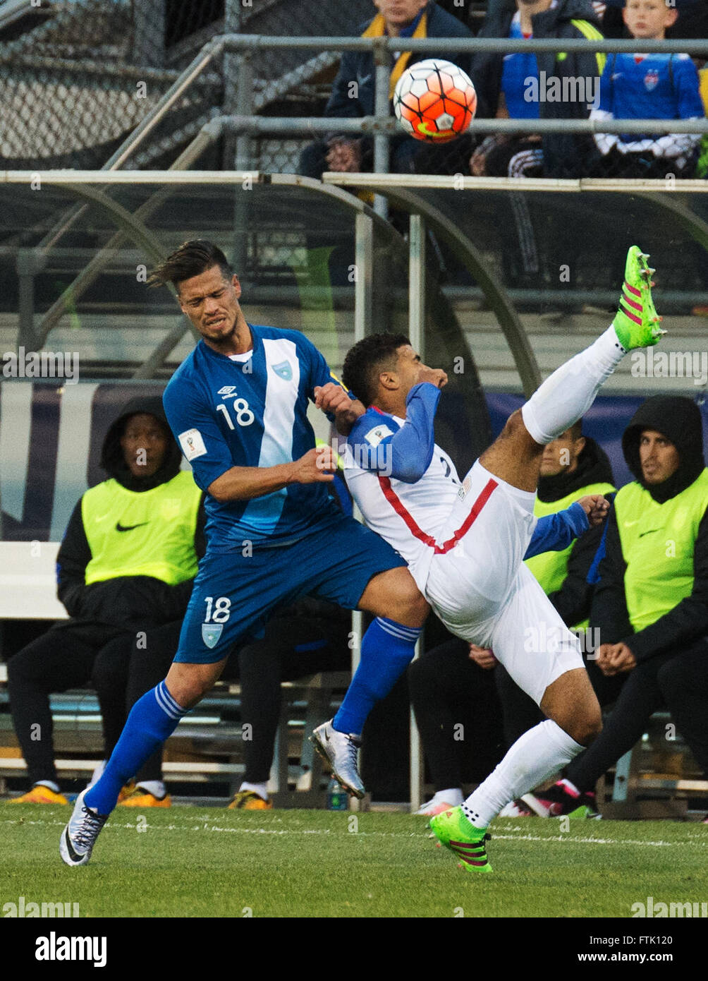 Ohio, USA. 29th March, 2016. US defender DeAndre Yedlin (white) bicycle kicks the ball over Guatemala's  Stefano Cincotta (blue) during a World Cup Qualifying Match. Columbus, Ohio, USA Credit:  Brent Clark/Alamy Live News Stock Photo