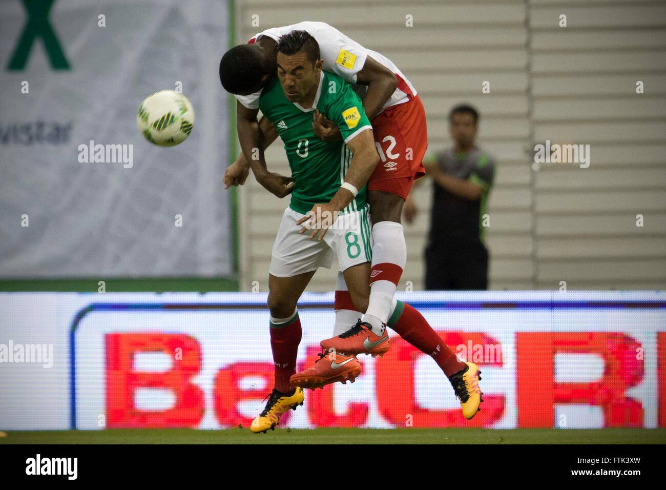 Ciudad De Mexico, Mexico. 29th Mar, 2016. Mexico's Marco Fabian (Front) vies with Canada's Doneil Henry during their qualifying match for 2018 Russia World Cup at Azteca Stadium in Mexico City, capital of Mexico, on March 29, 2016. Mexico won 2-0. © Alejandro Ayala/Xinhua/Alamy Live News Stock Photo