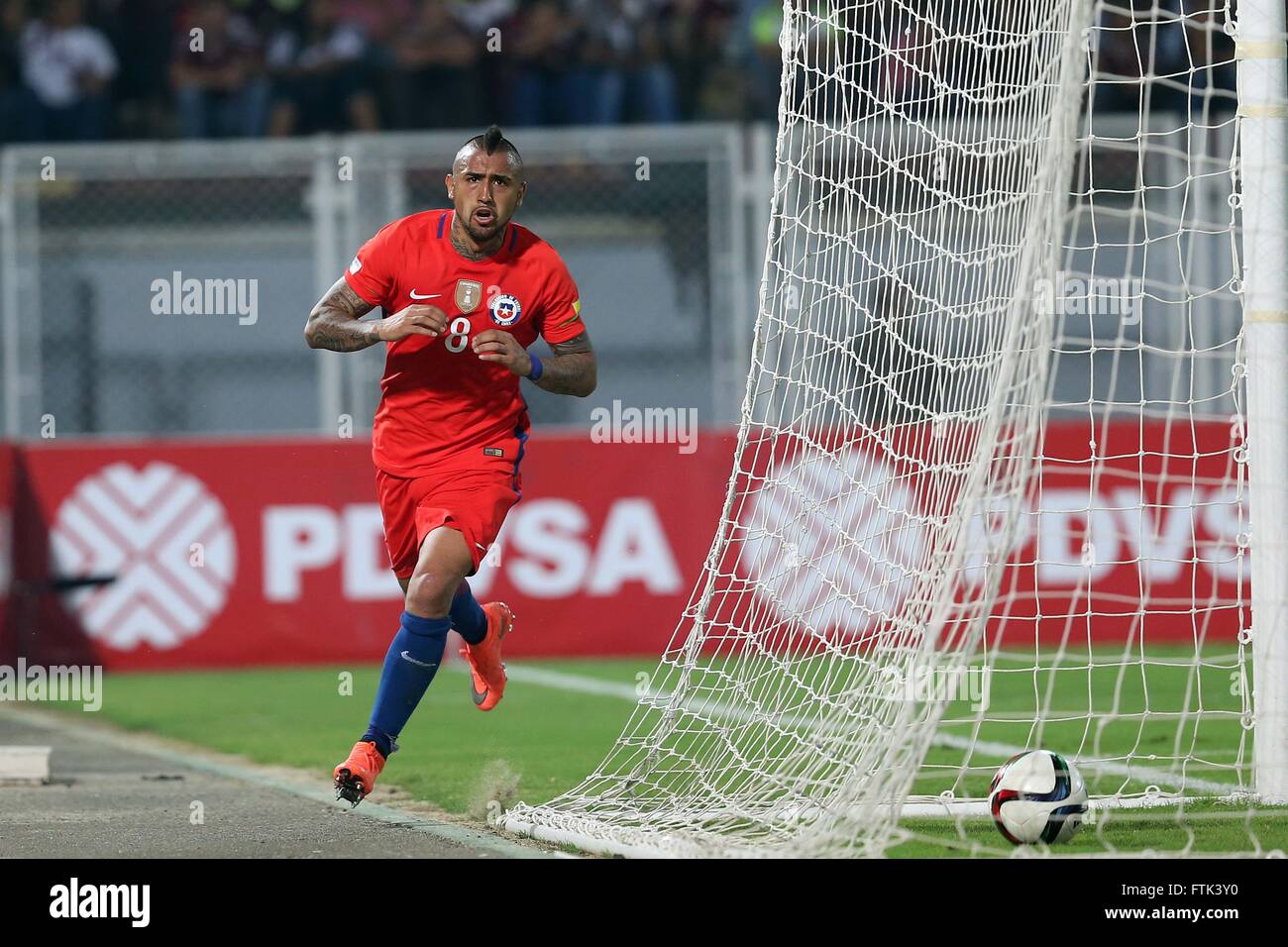 Barinas, Venezuela. 29th Mar, 2016. Image provided by Chile's National Professional Football Association (ANFP, for its acronym in Spanish) shows Chile's Arturo Vidal celebrating after scoring during the qualifying match for 2018 Russia World Cup against Venezuela at Agustin Tovar Stadium in Barinas, Venezuela, on March 29, 2016. Chile won 4-1. © ANFP/Xinhua/Alamy Live News Stock Photo