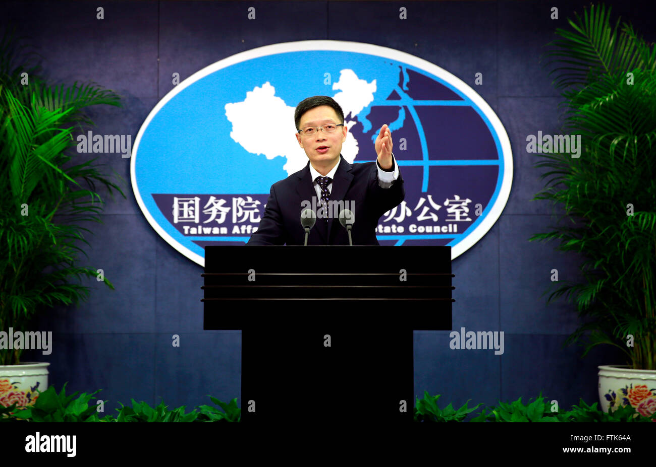 (160330) -- BEIJING, March 30, 2016 (Xinhua) -- An Fengshan, spokesman of the State Council's Taiwan Affairs Office, gestures to a journalist during a regular press conference in Beijing, capital of China, March 30, 2016. The Chinese mainland opposes any attempt to undermine the foundation of cross-Strait negotiations or imposition of artificial barriers to related process and the development of cross-Strait relations, said An Fengshan.(Xinhua/Pan Xu)(mcg) Stock Photo