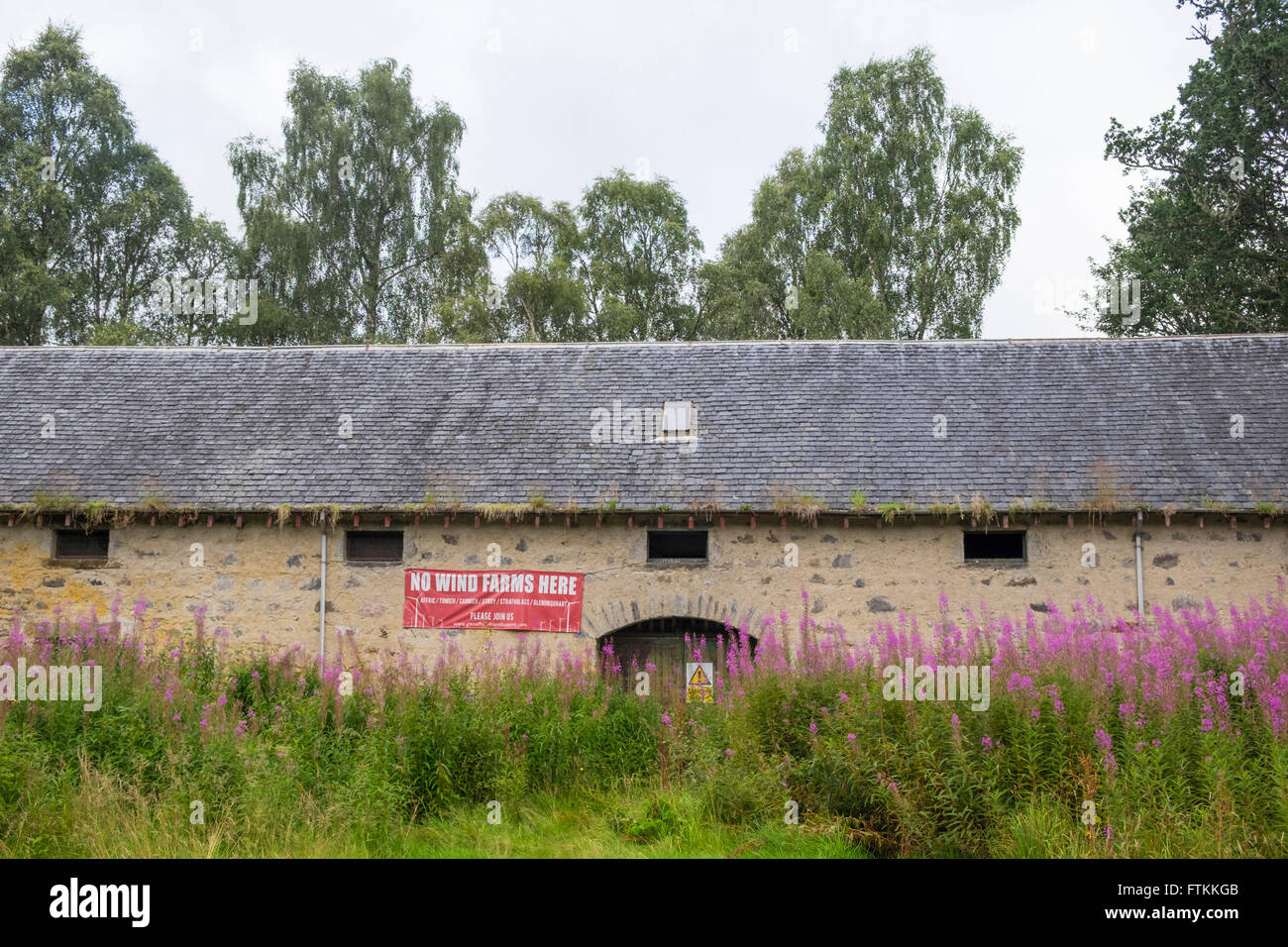 'No Wind Farms Here' banner on rural building Stock Photo