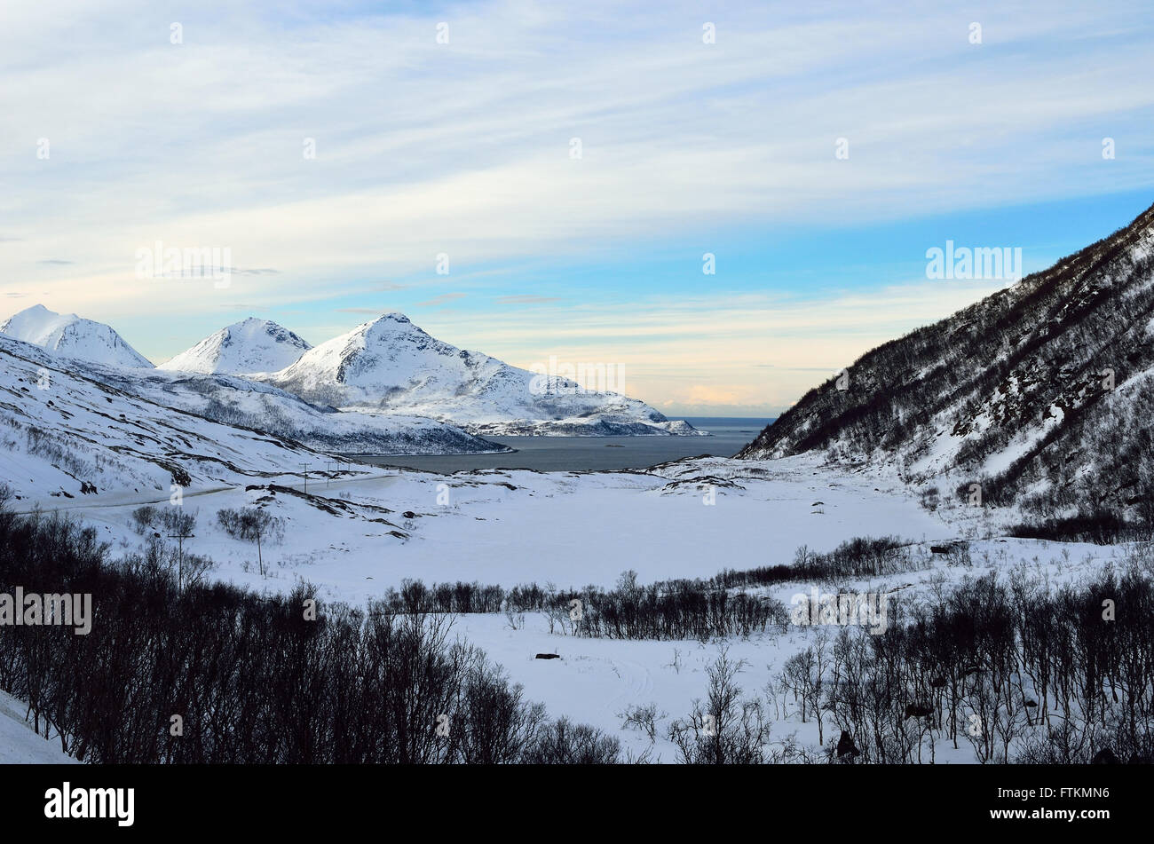 snowy mountain with sunshine blue sky and fjord landscape Stock Photo ...