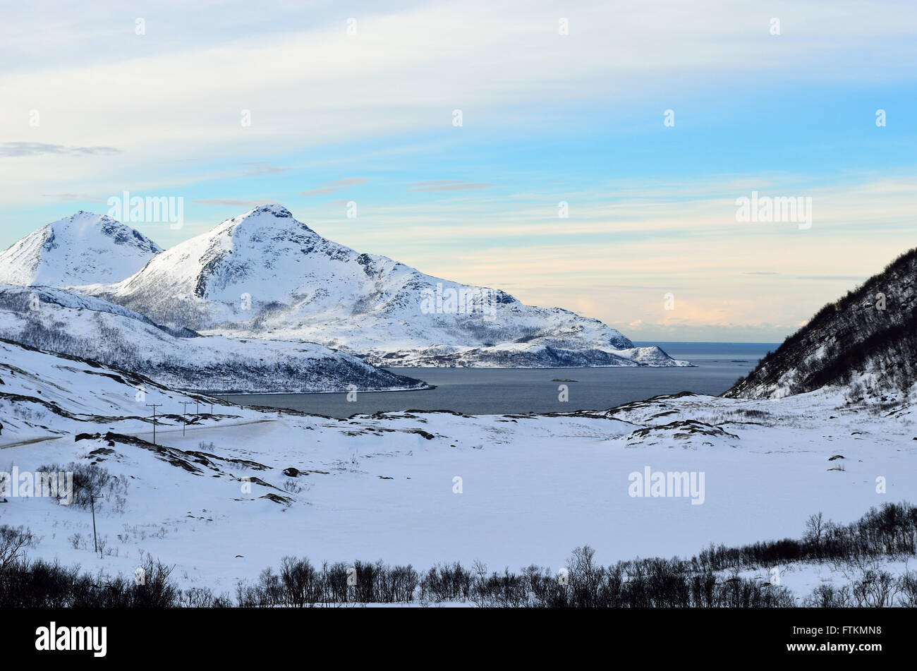 snowy mountain with sunshine blue sky and fjord landscape Stock Photo ...