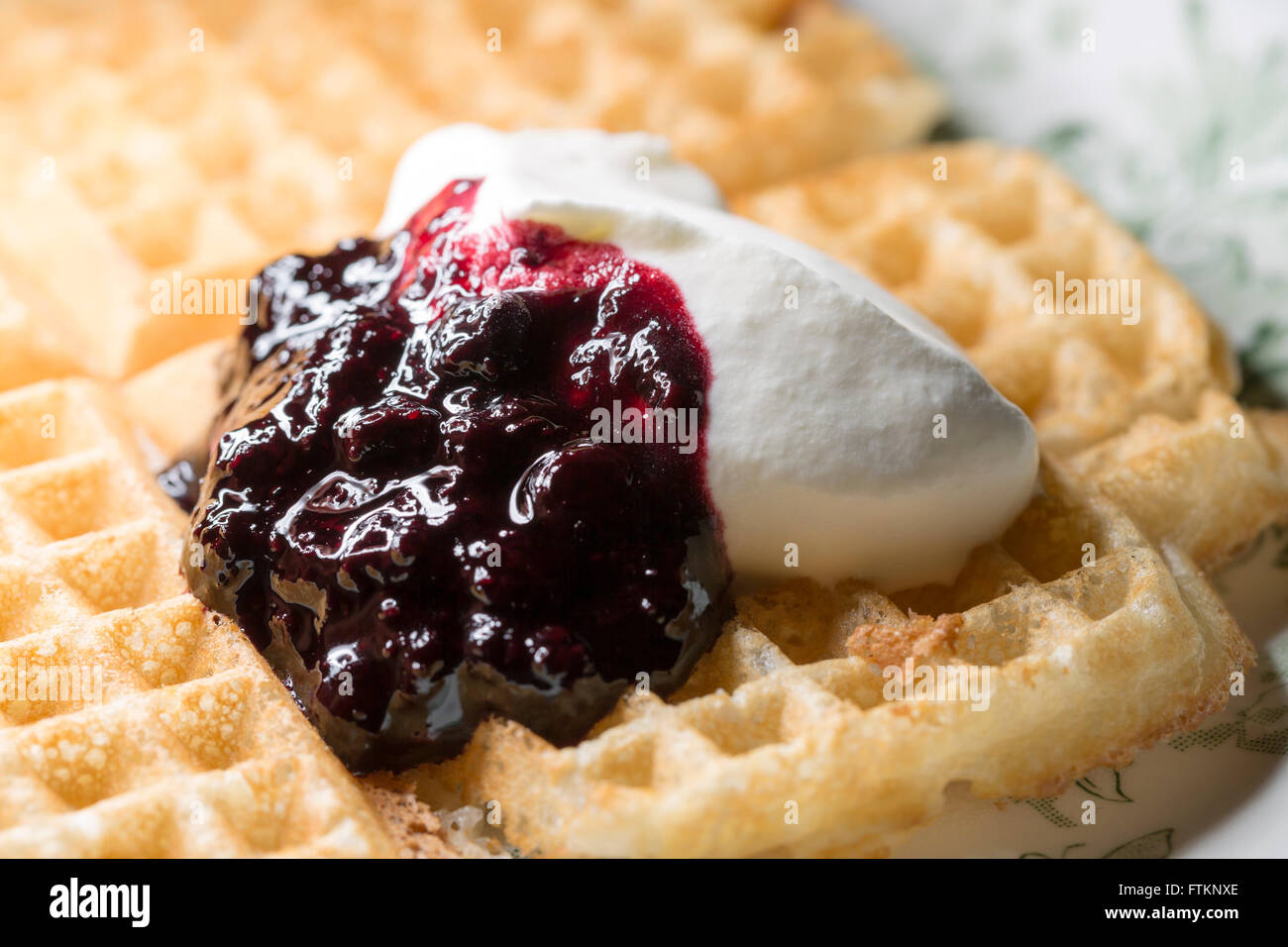 Waffle with Blueberry Jam and Whipped Cream Stock Photo