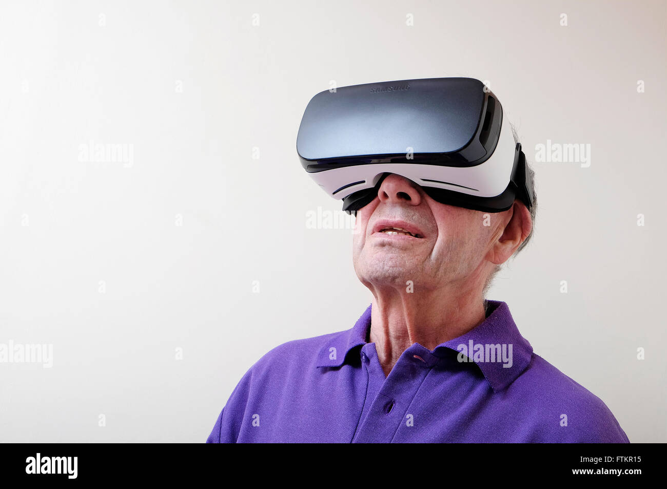 virtual reality headset worn by senior man Stock Photo Alamy