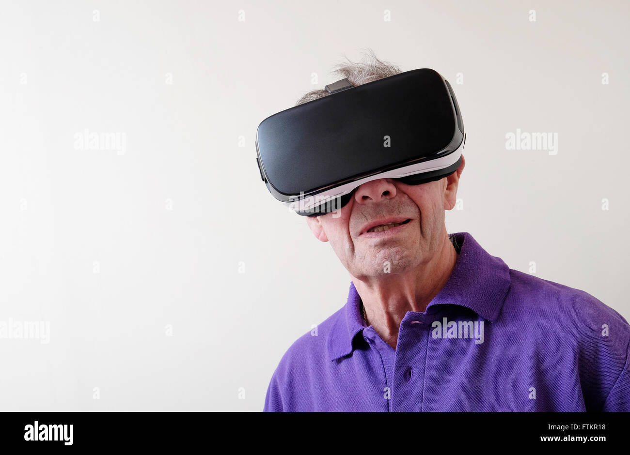 virtual reality headset worn by senior man Stock Photo - Alamy