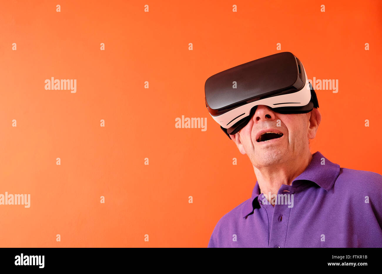 virtual reality headset worn by senior man Stock Photo Alamy