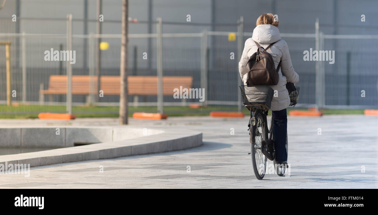 People riding bike in the city, outdoor photography Stock Photo