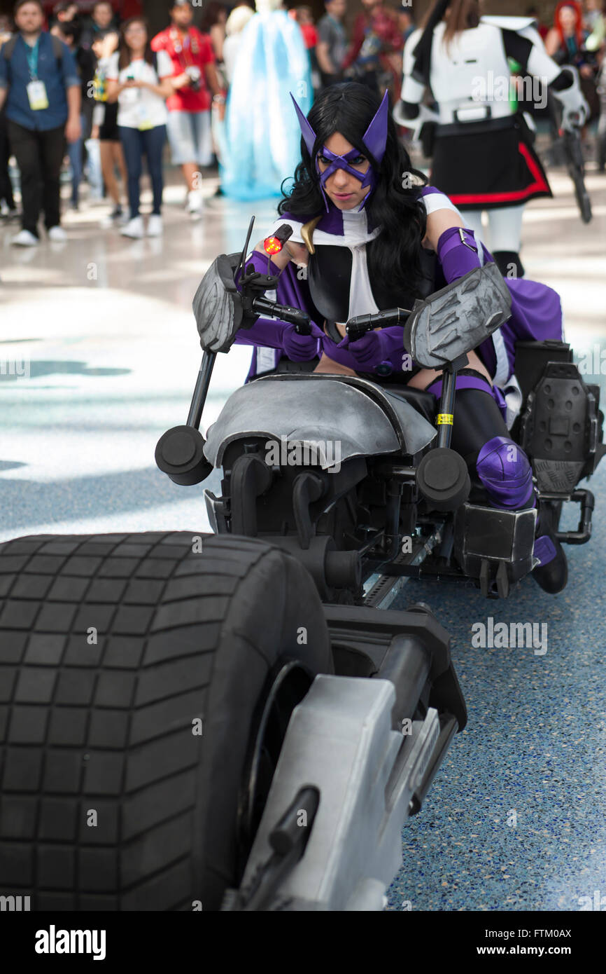 WONDERCON: Los Angeles Convention Center, March 25 thru 27, 2016. Cosplayer dressed as Batgirl riding a replica of the Batcycle. Stock Photo