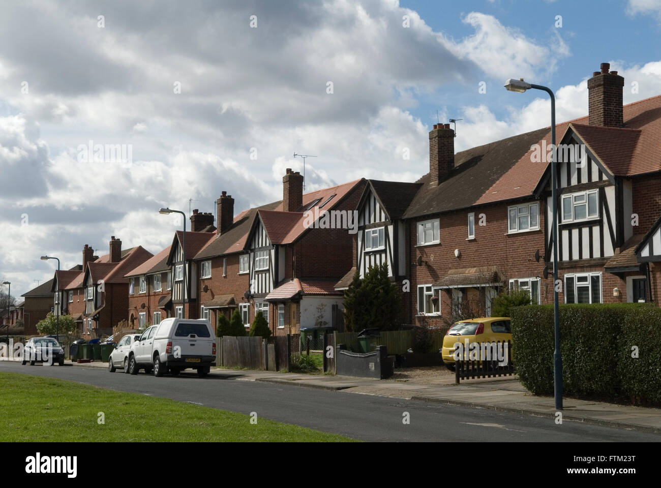 Housing semi detached homes, car and vans parked outside south London 2016  2010s UK HOMER SYKES Stock Photo - Alamy