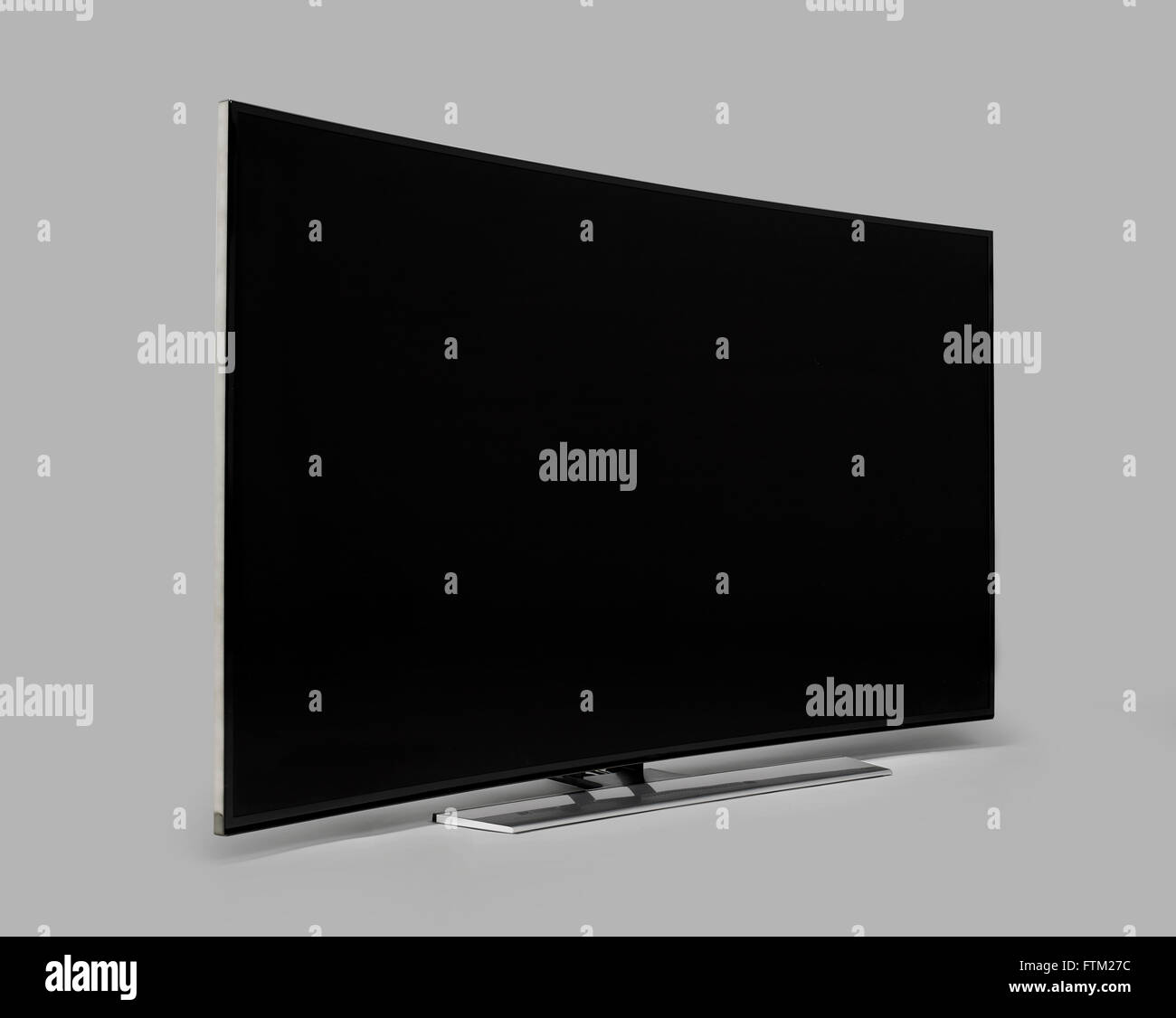 Curved Widescreen TV on grey background Stock Photo - Alamy
