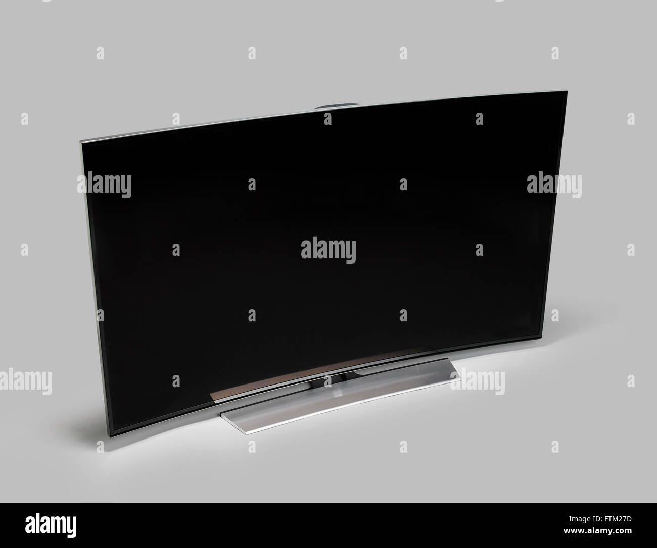 Curved Widescreen TV on grey background Stock Photo