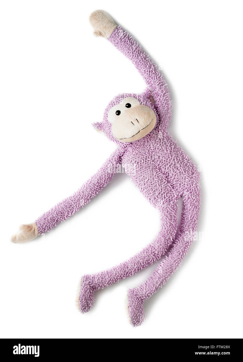 Overhead shot of a pink monkey toy Stock Photo