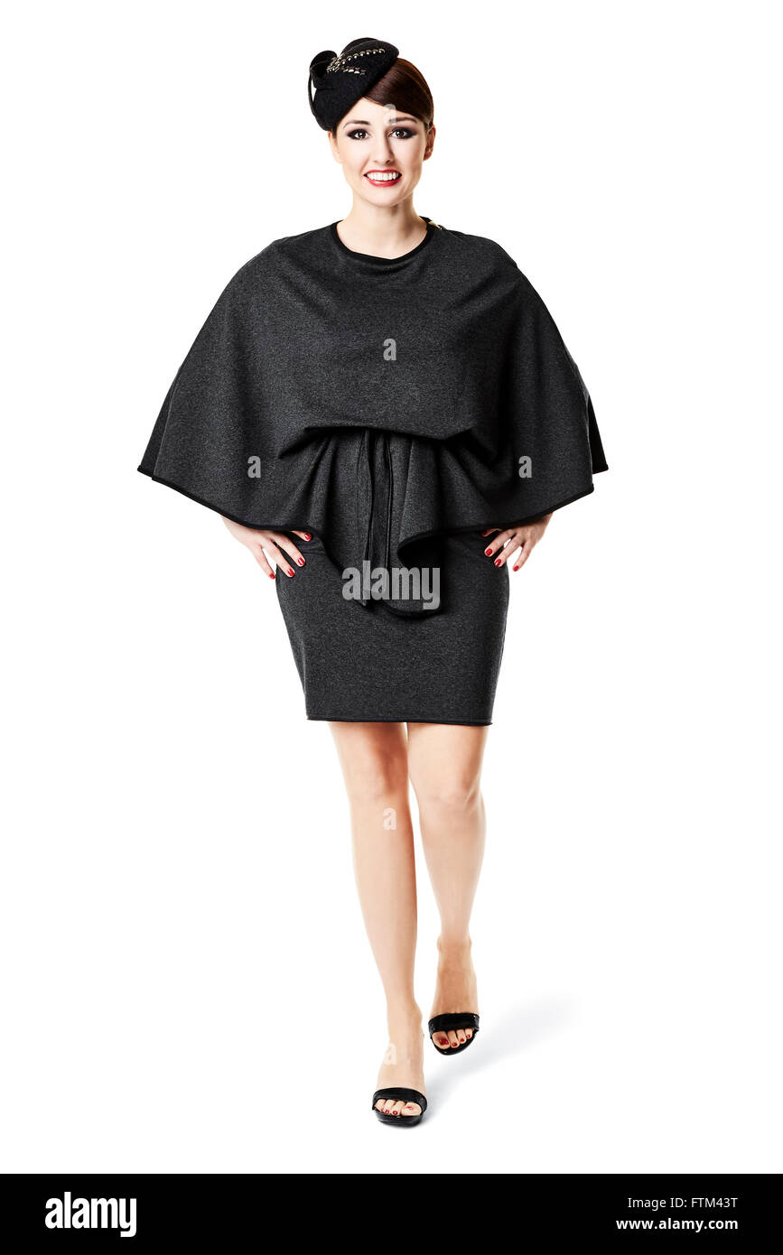 Studio shot of woman in black dress and retro hat Stock Photo - Alamy
