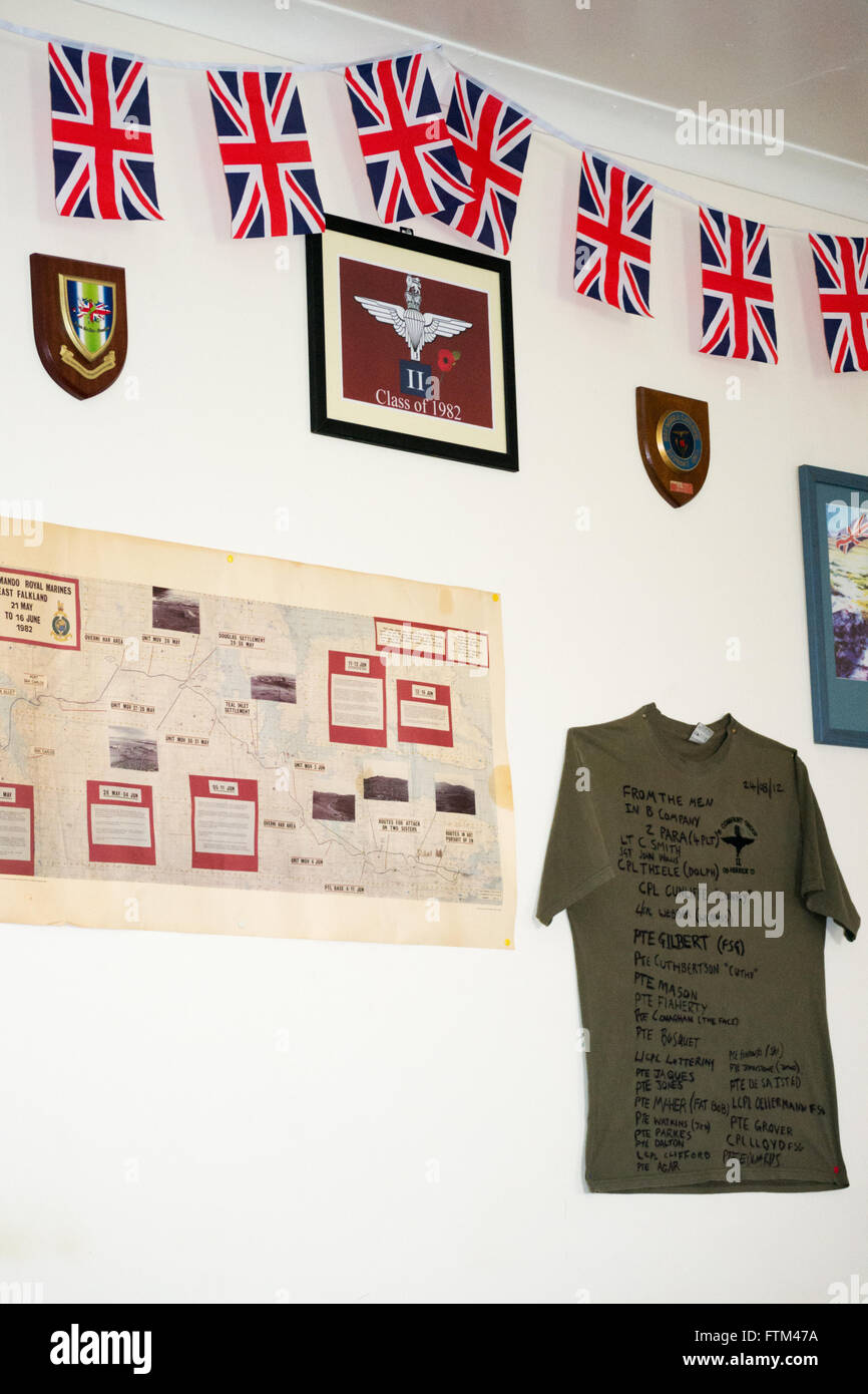 British flags and military memorabilia including signed t-shirt  from B Company, 2nd Para in the village hall at Goose Green, Ea Stock Photo