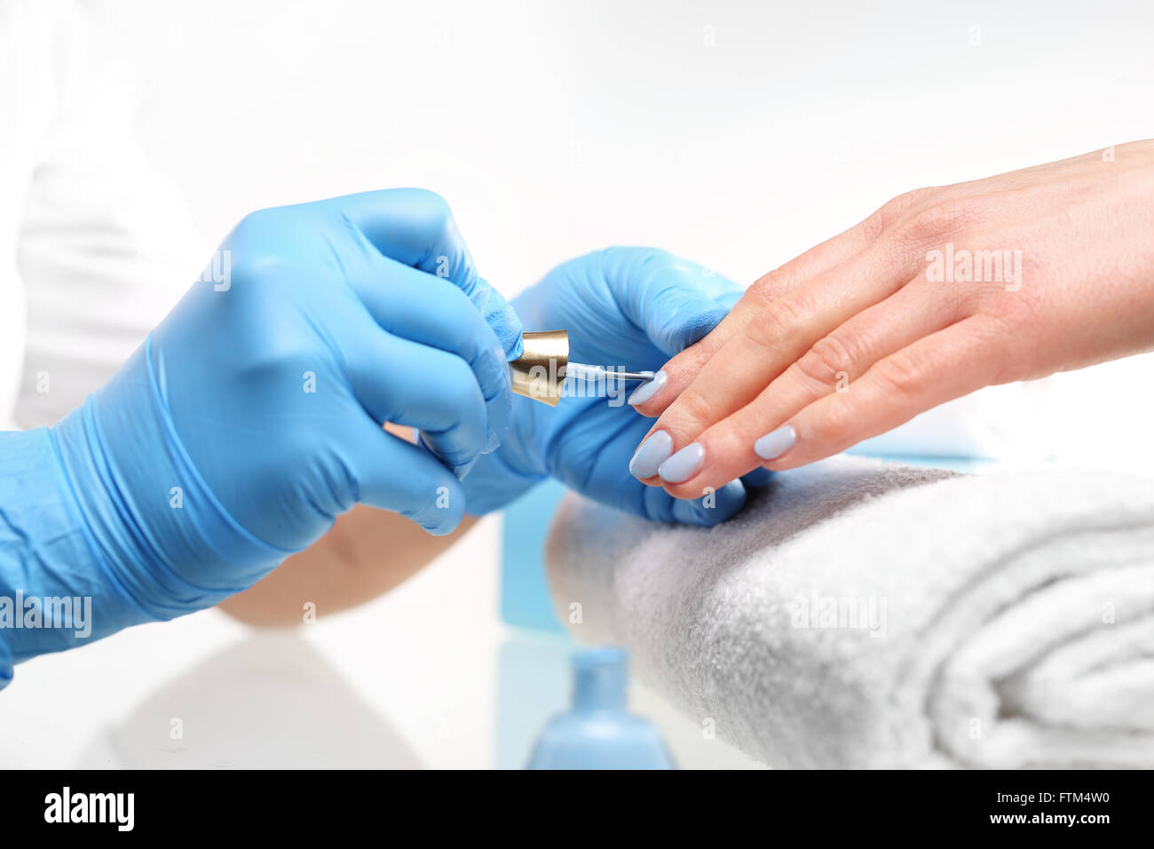 Blue manicure. Well-groomed female hands, a colorful manicure, Styling nail color nail polish. Stock Photo